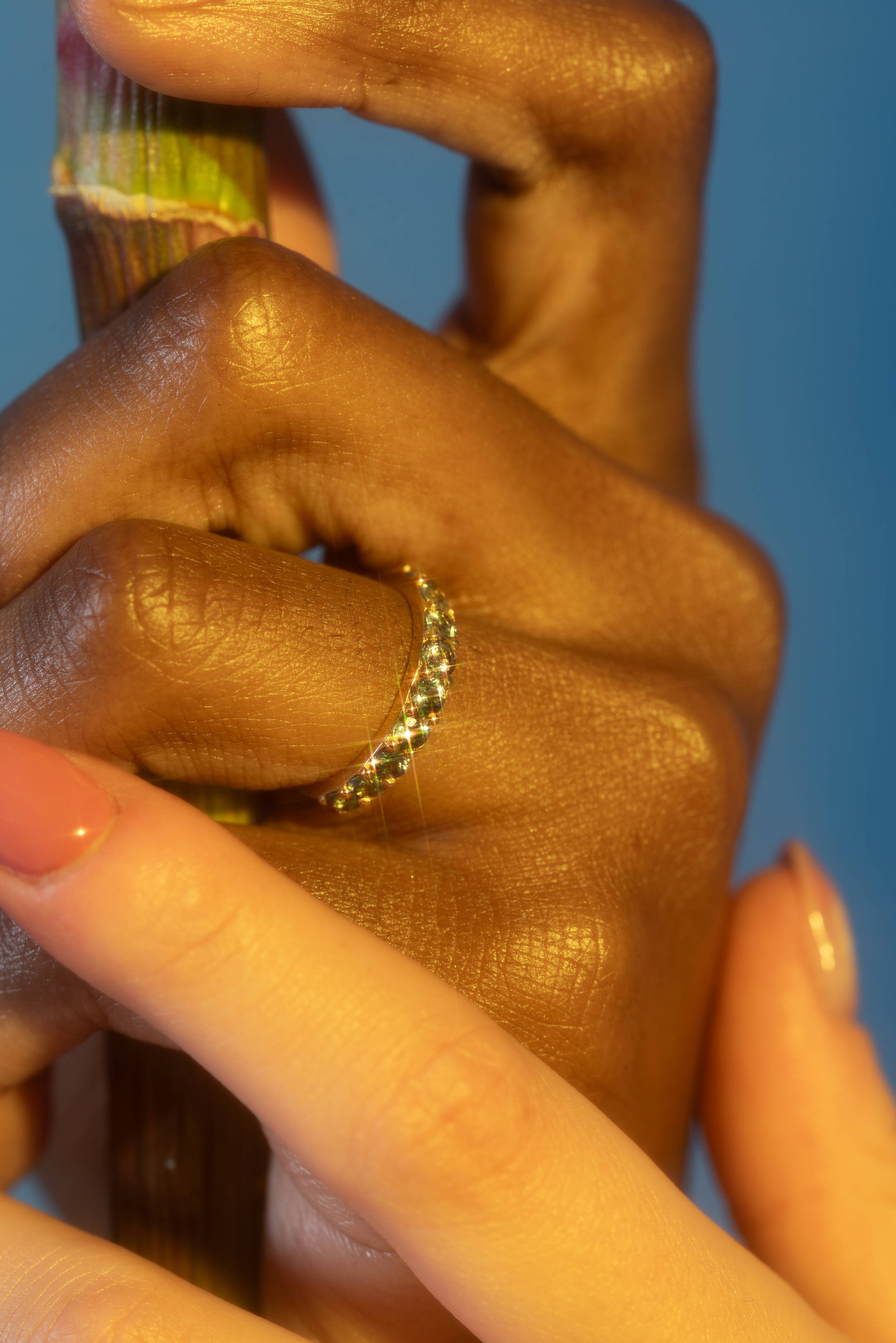 Model wearing Dew 3mm / Teal Sapphire Ring on ring finger