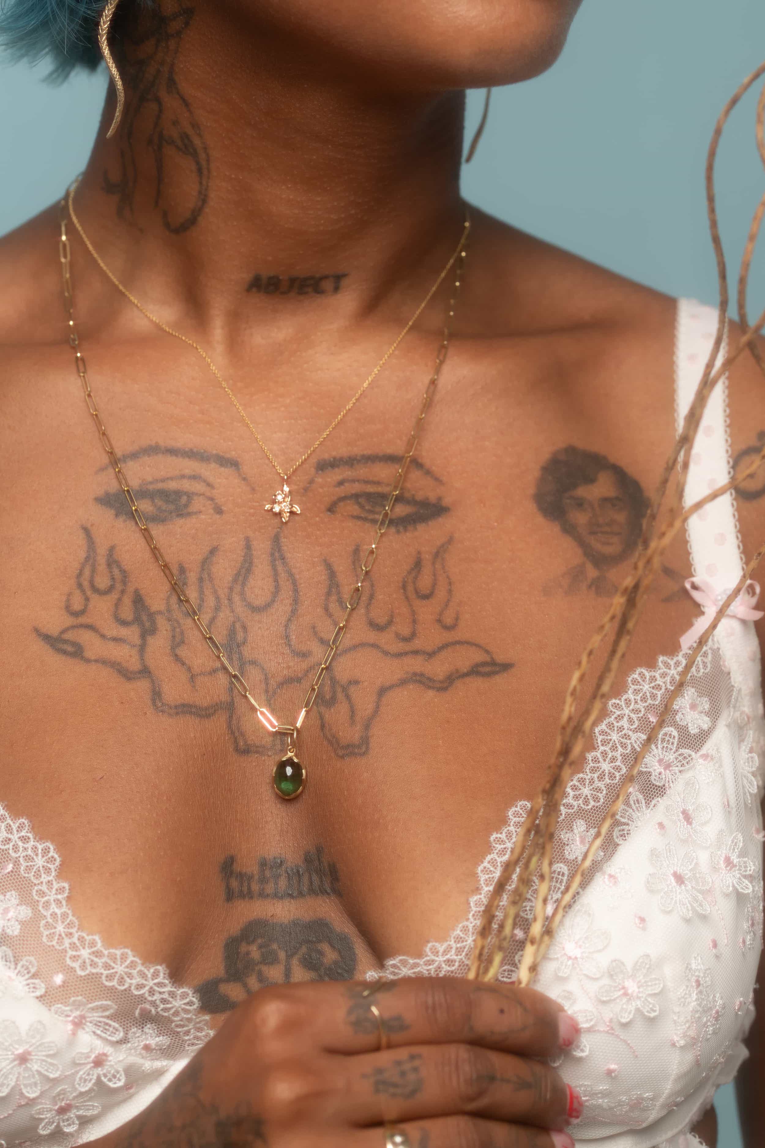 Model wears Bunch / Diamond Pendant By O Channell Designs