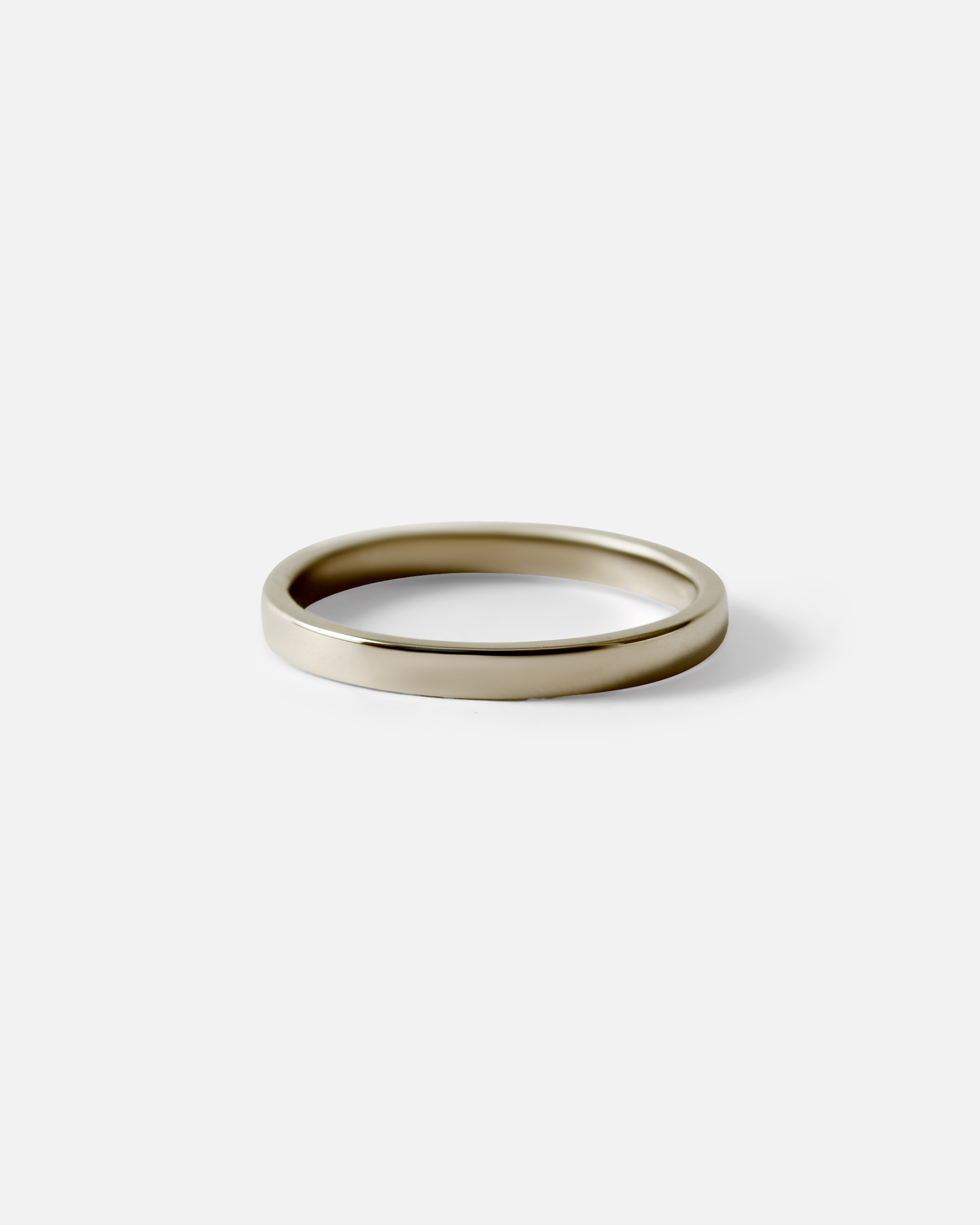 Angled view of Flat Band / 2mm Customizable By Hiroyo in 14k white gold