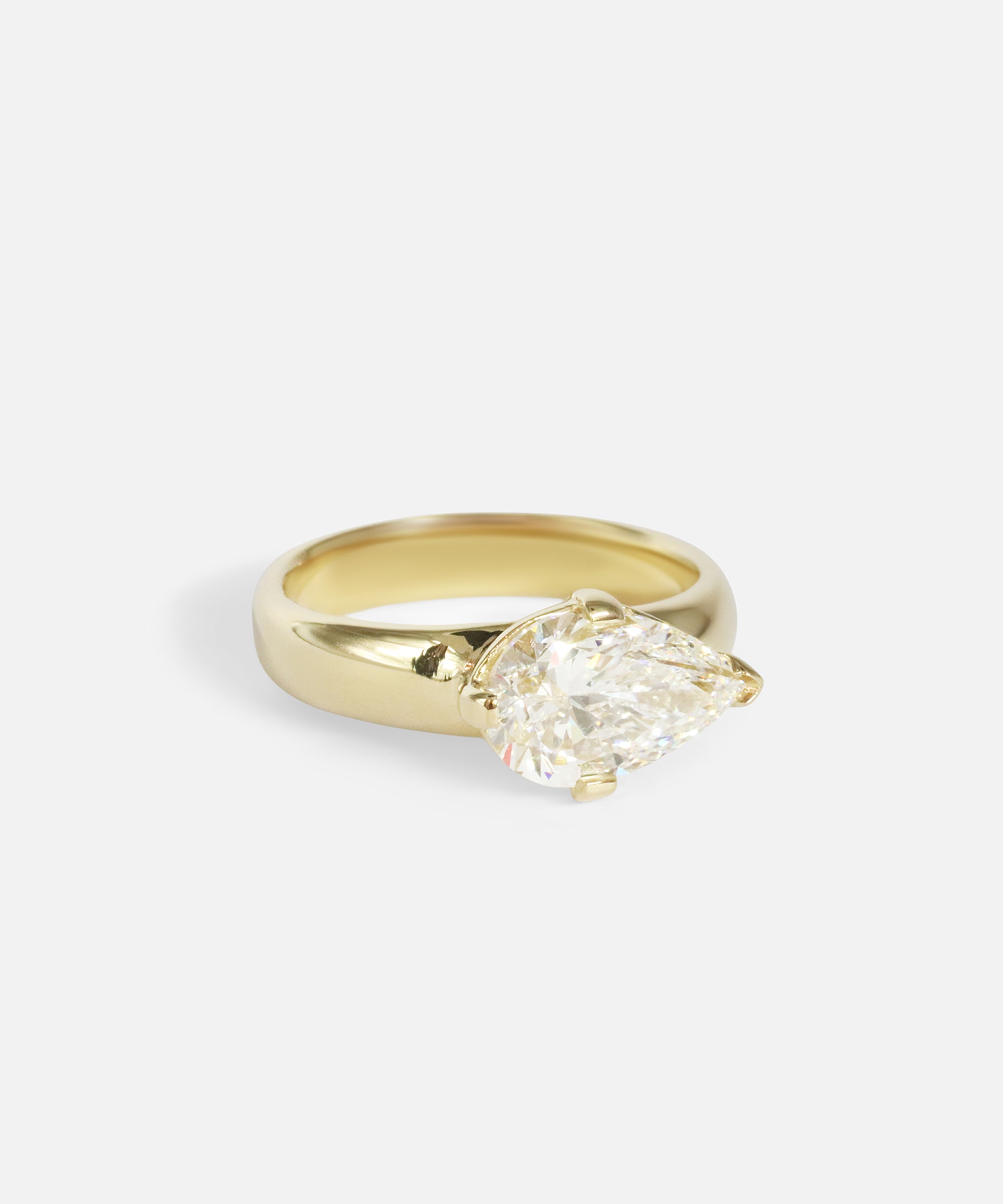 Angled view of Comet Ring / Lab Pear Diamond in 14k yellow gold by Joko