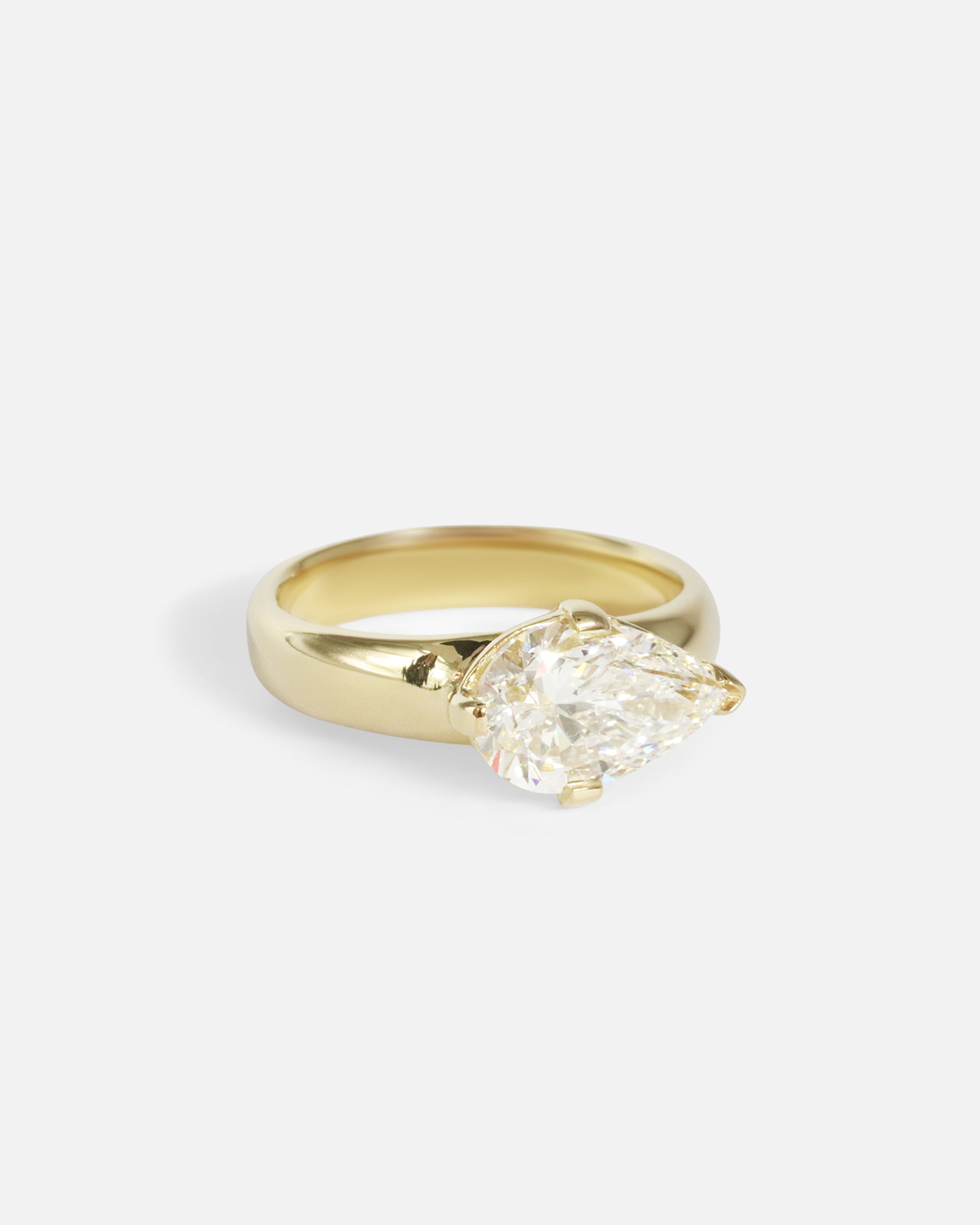 Angled view of Comet Ring / Lab Pear Diamond in 14k yellow gold by Joko