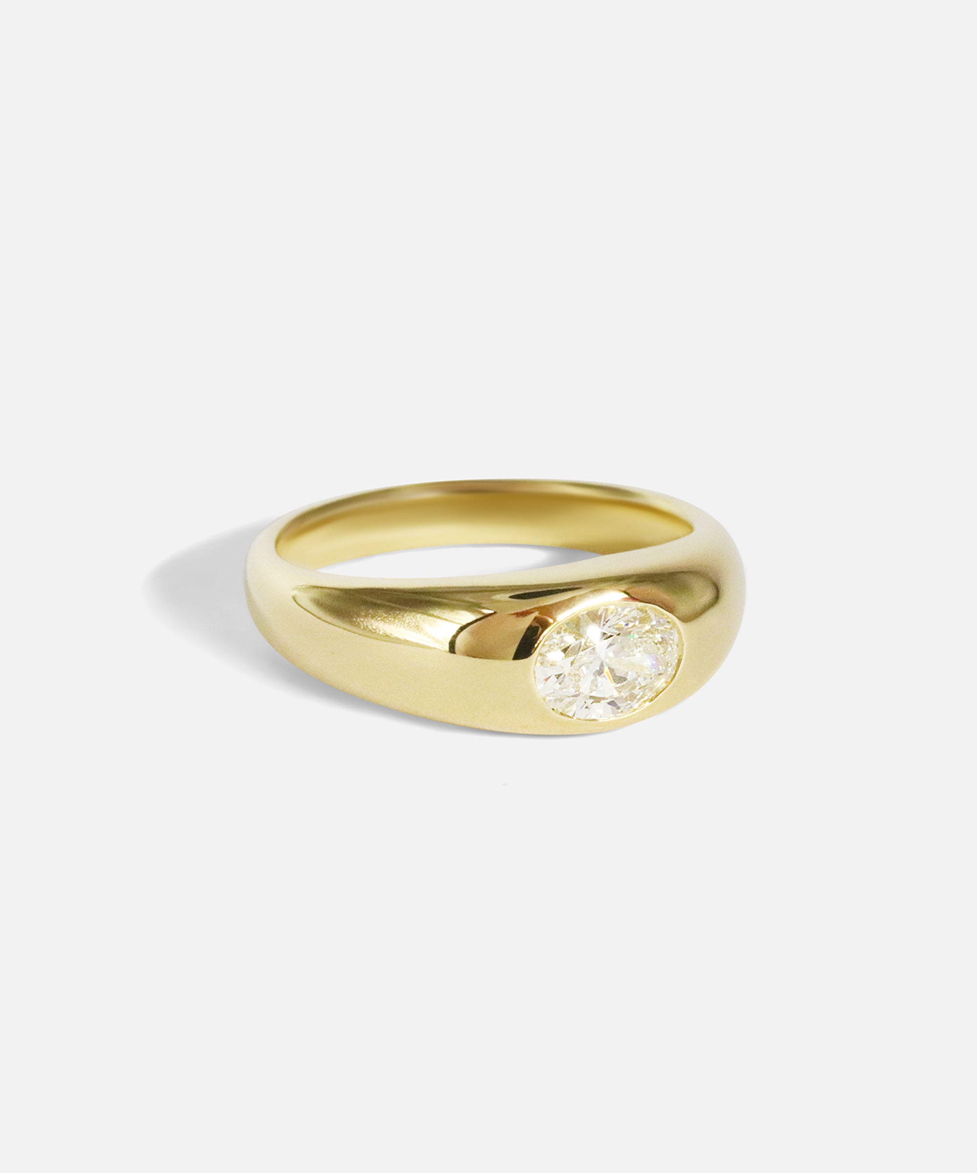 Side view of Optic Oval Signet Ring / Diamond in 14k yellow gold by Joko