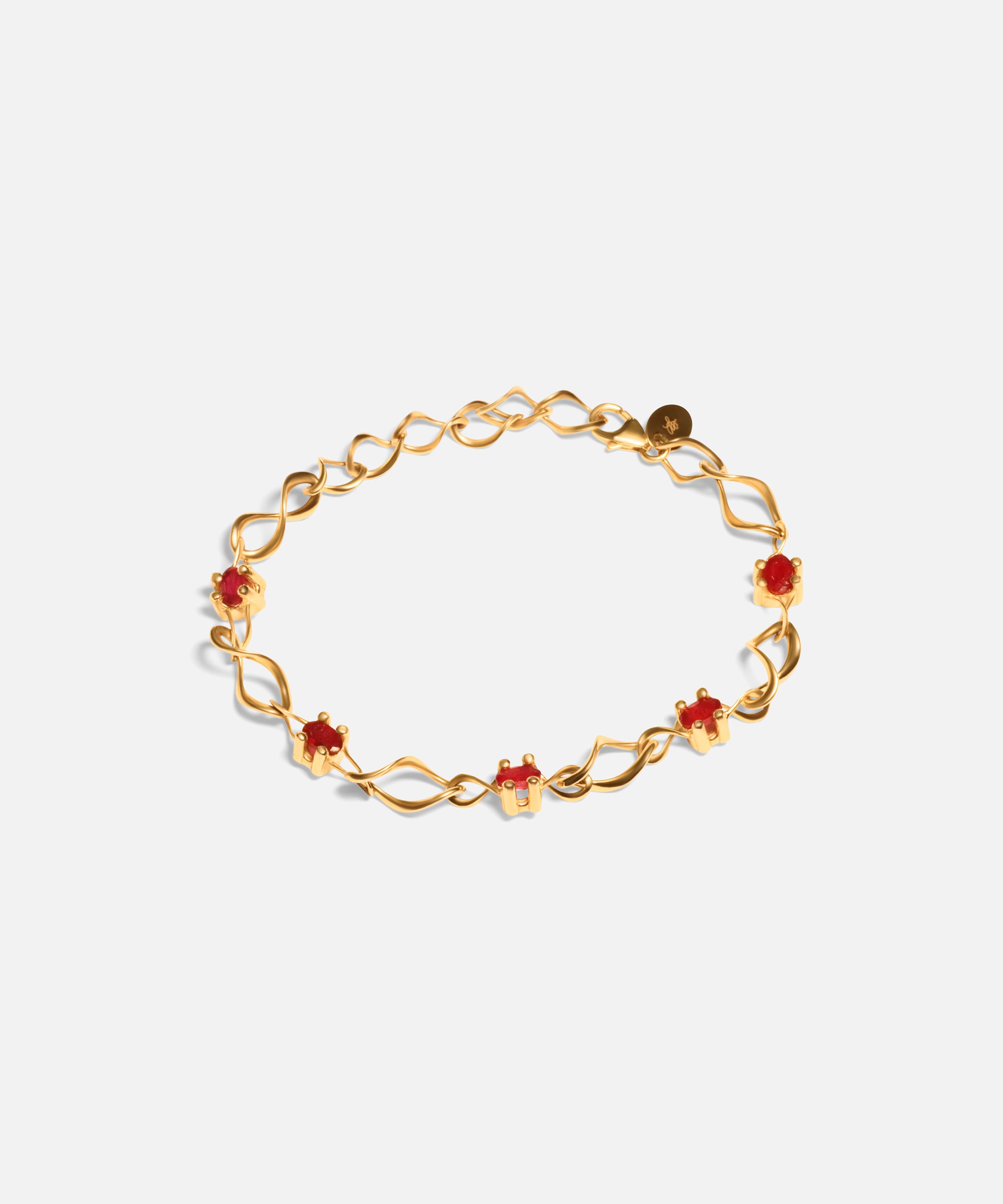 Side view of Nucleus Intermittendi Bracelet / Ruby in 14k yellow gold by Lucia B Marti