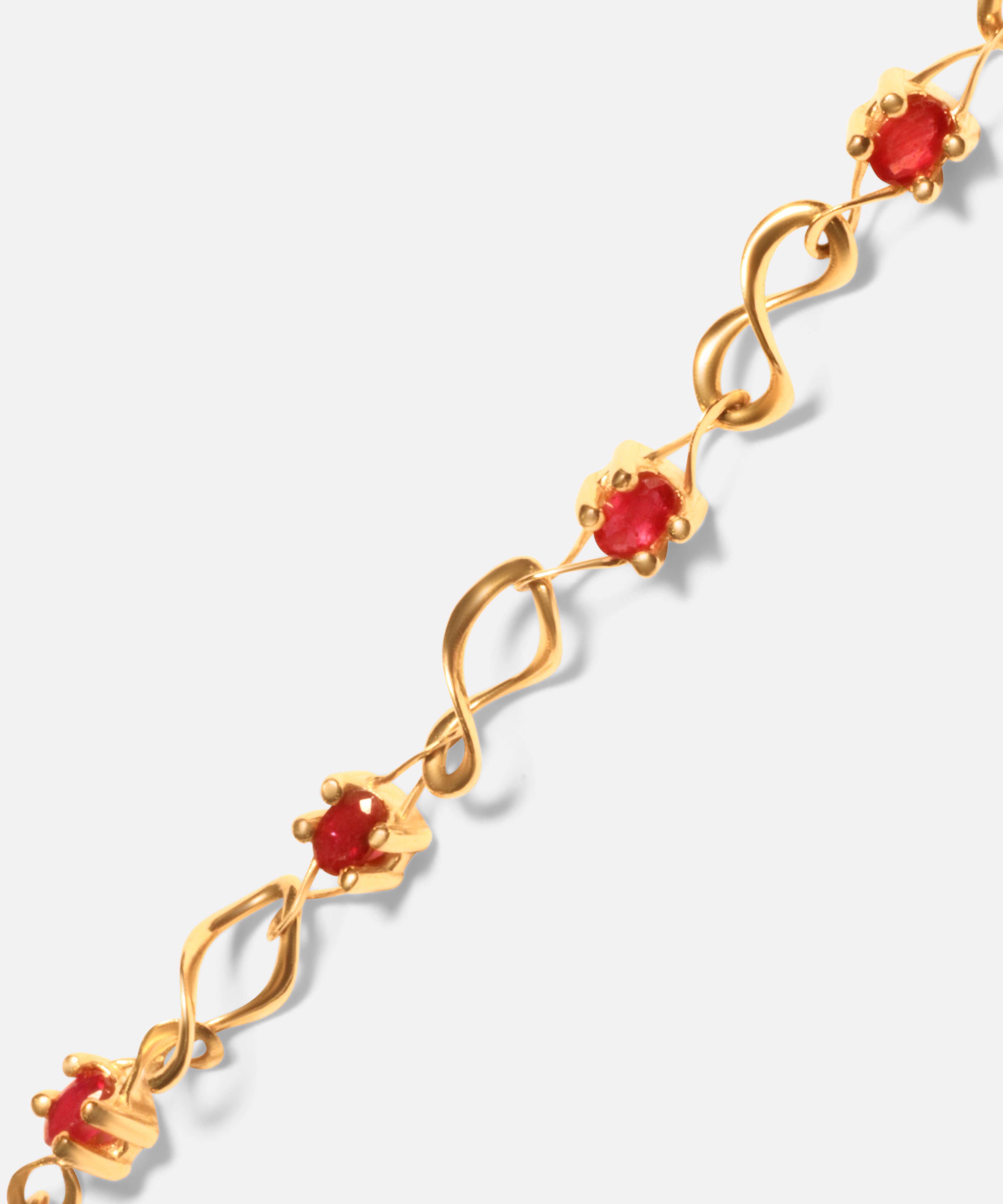 Close view of Nucleus Intermittendi Bracelet / Ruby in 14k yellow gold by Lucia B Marti