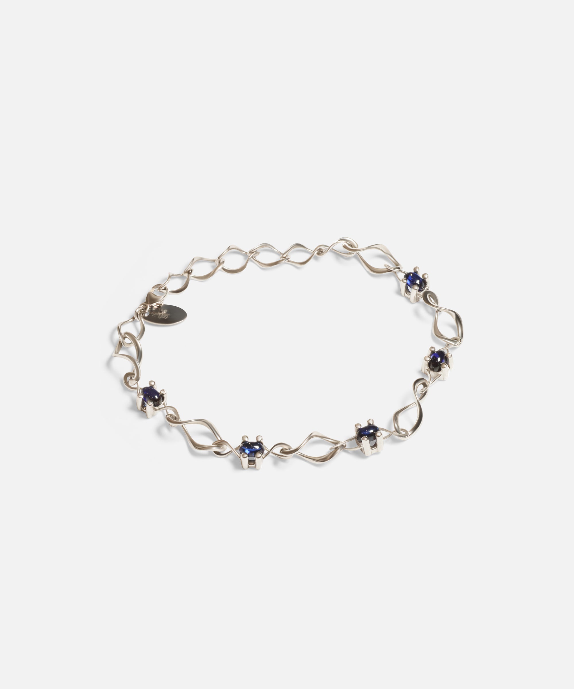 Side view of Nucleus Intermittendi Bracelet / Sapphire in 14k white gold by Lucia B Marti