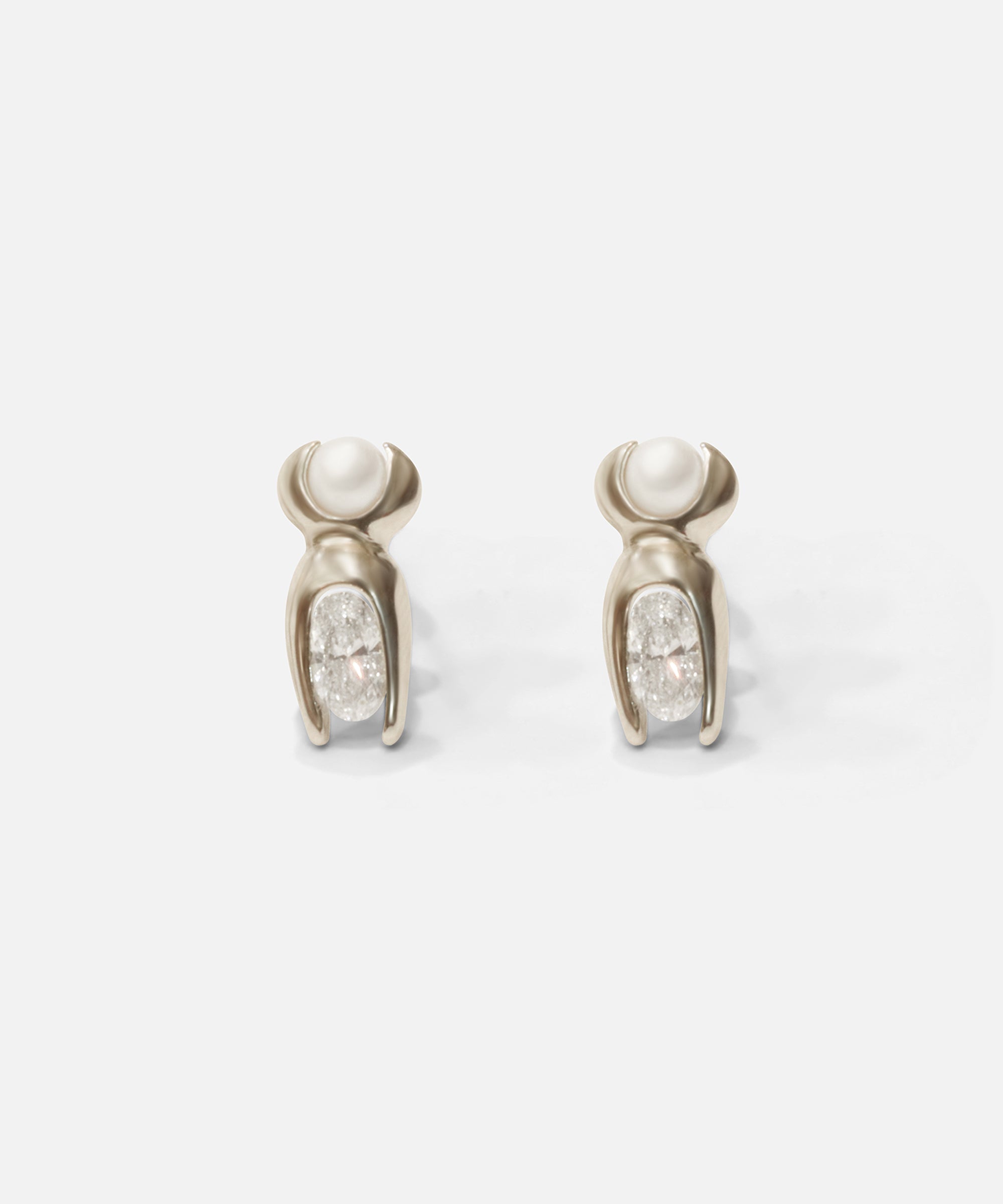 Front view of Mutation Earrings / Pearl & Diamond in 14k white gold by Lucia B Marti