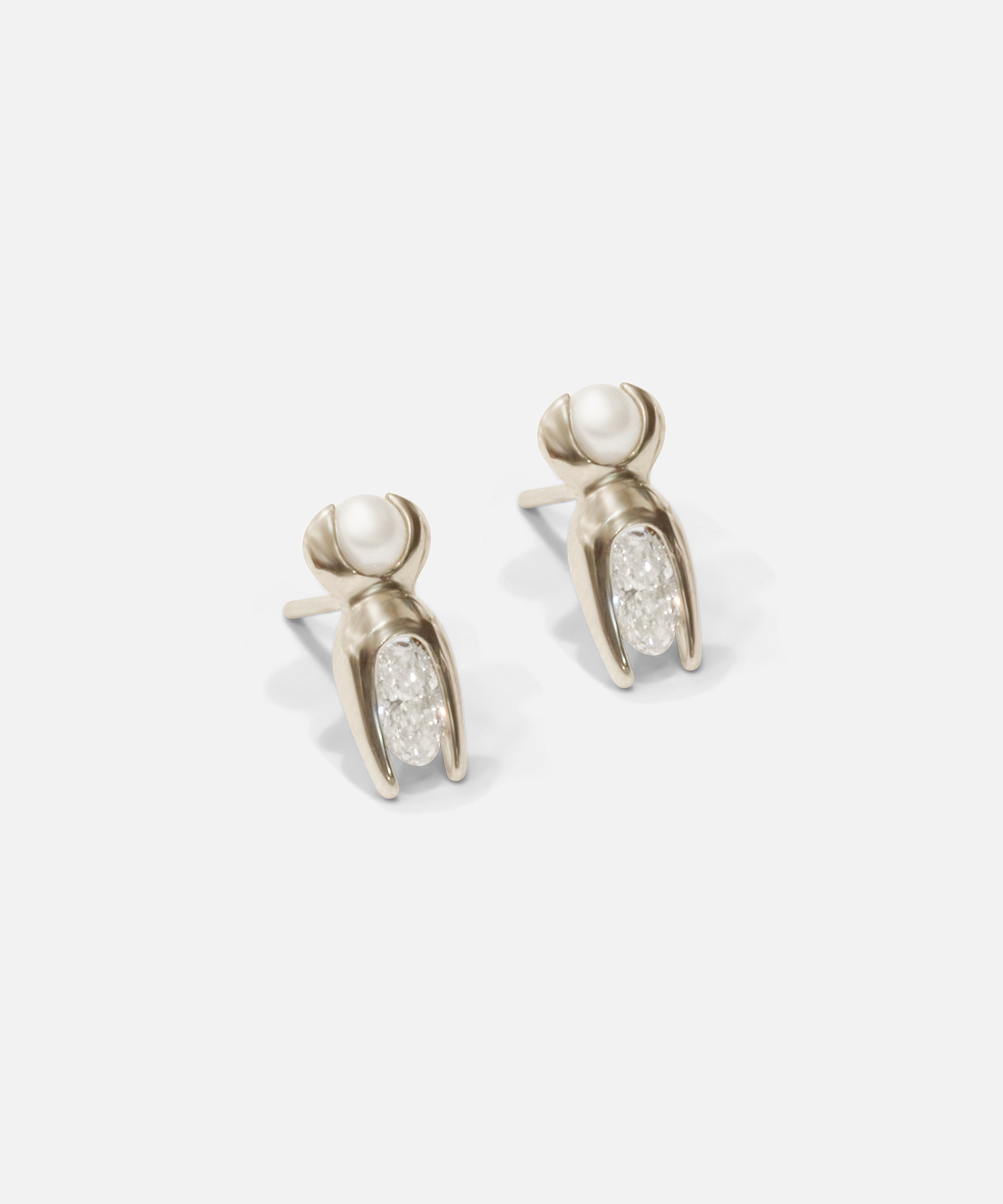 Side view of Mutation Earrings / Pearl & Diamond in 14k white gold by Lucia B Marti