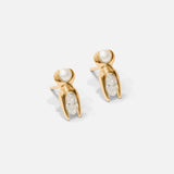 Side view of Mutation Earrings / Pearl & Diamond in 14k yellow gold by Lucia B Marti