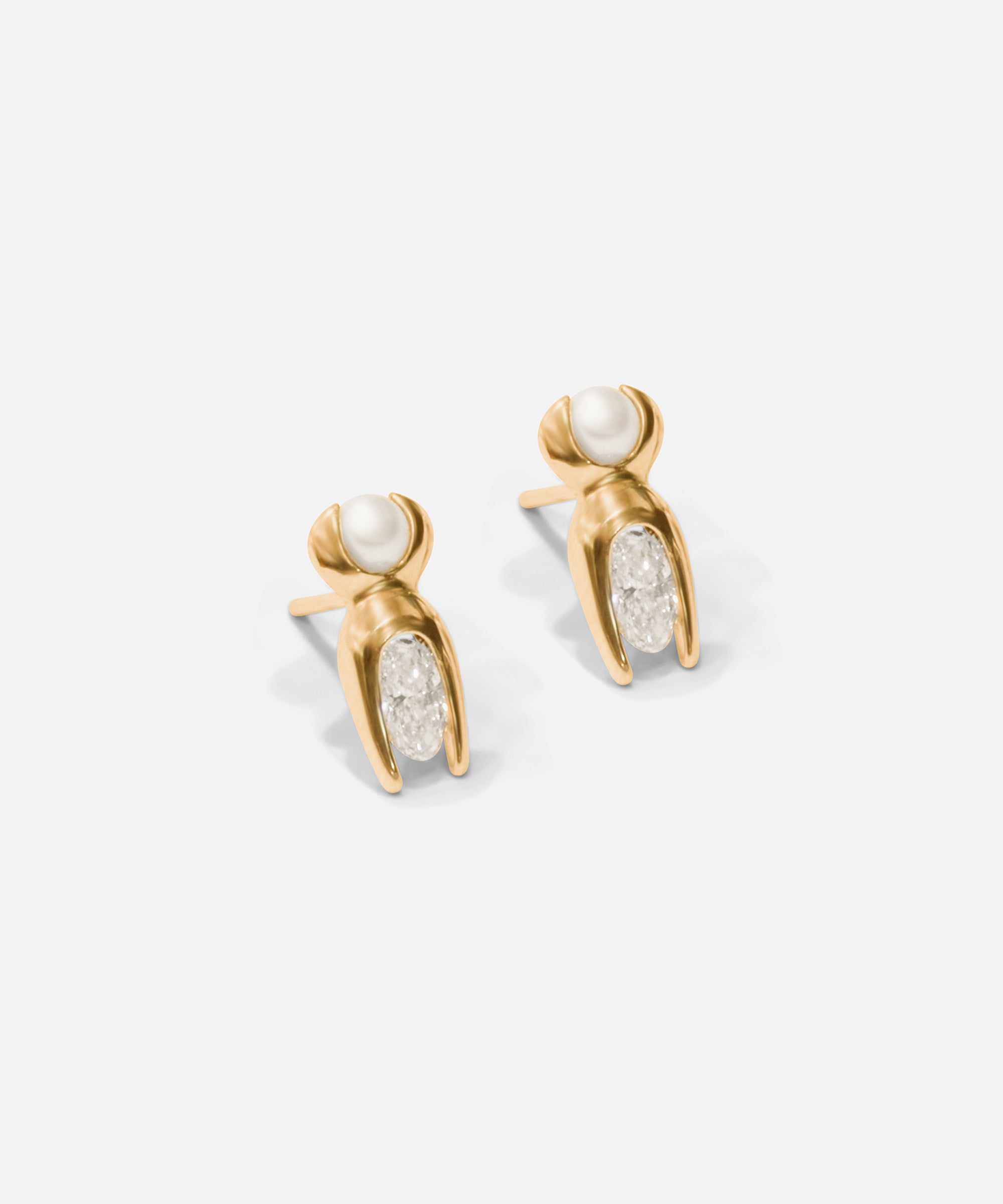 Side view of Mutation Earrings / Pearl & Diamond in 14k yellow gold by Lucia B Marti