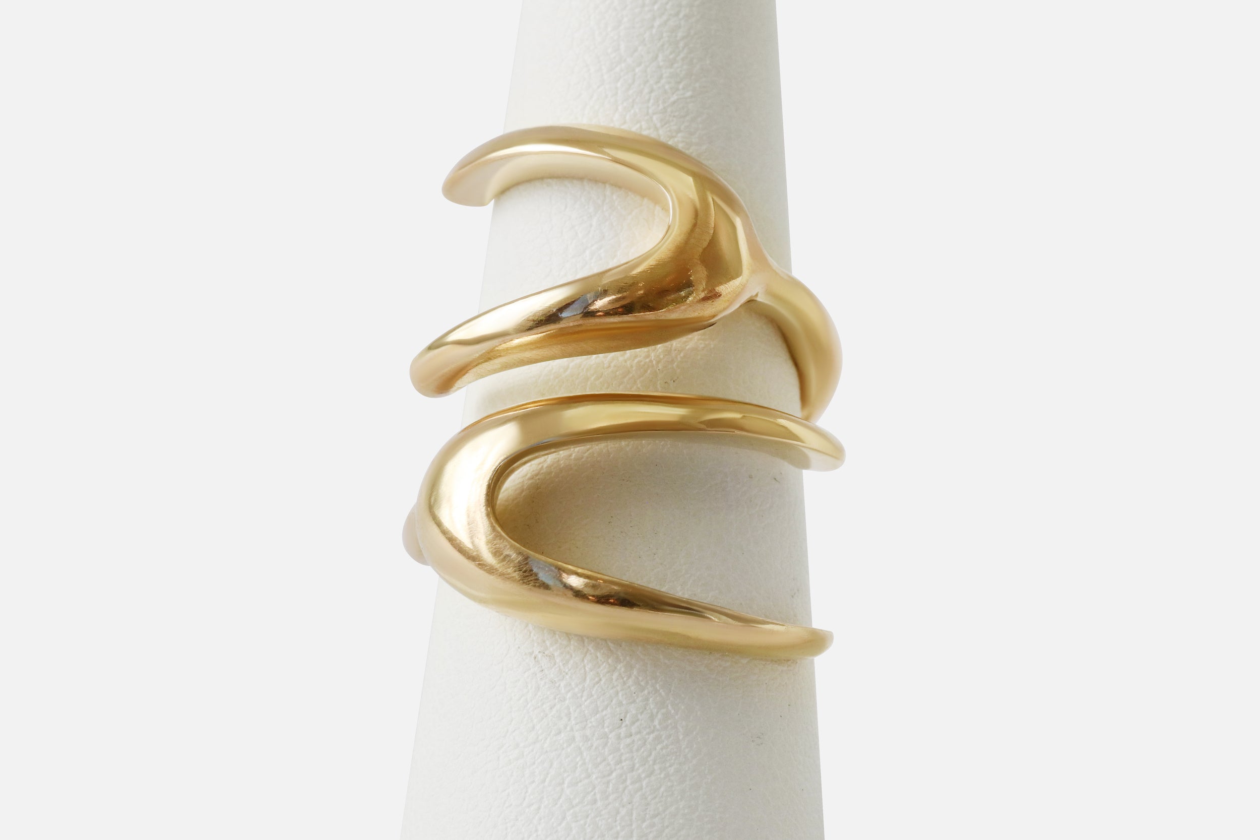 Front view of X Ring By Lucia B Marti on stand
