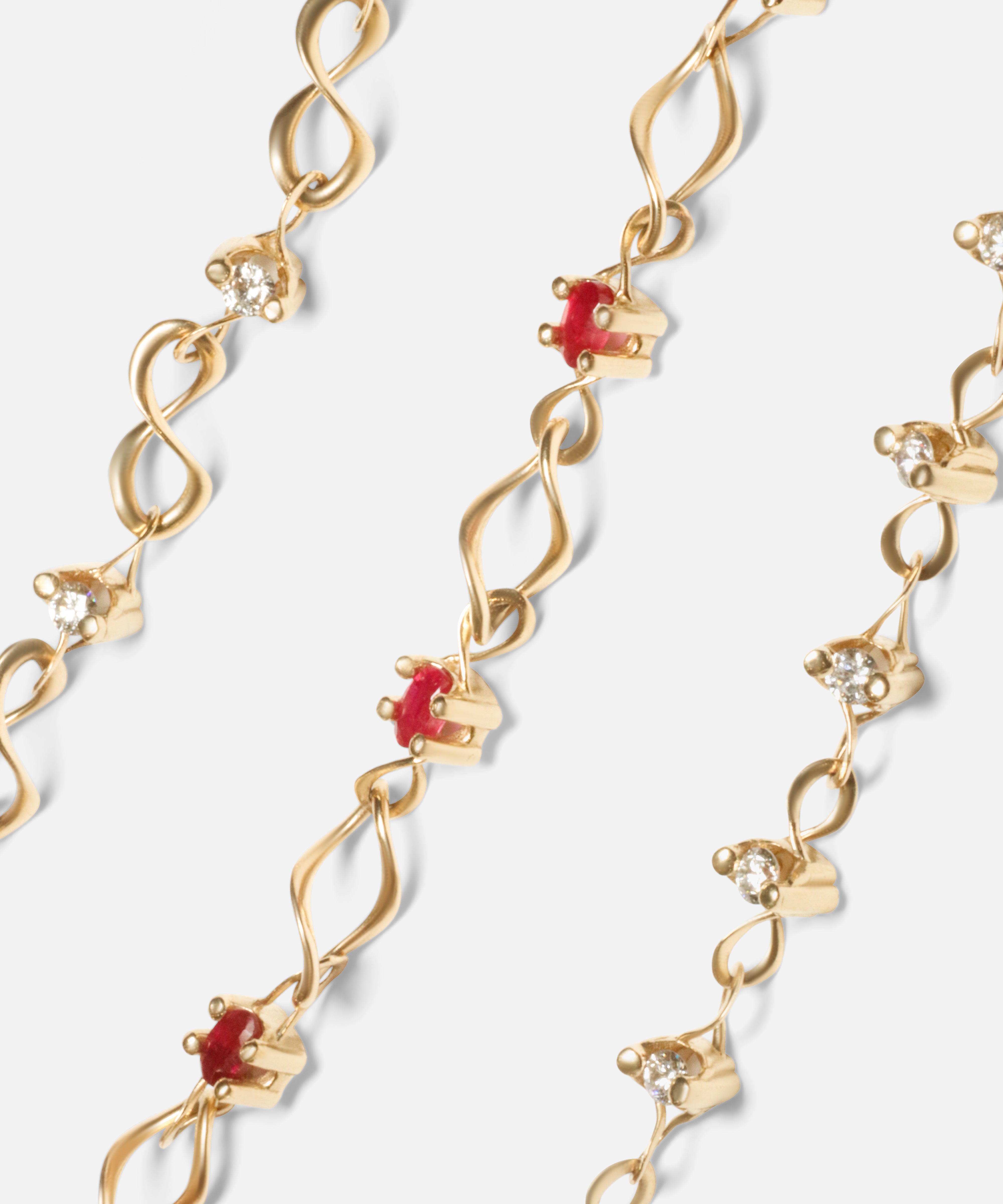 Group shot of Locus Max Bracelet, Nucleus Intermittendi Bracelet / Ruby, and Locus Intermittendi Bracelet in 14k Yellow Gold by Lucia B Marti