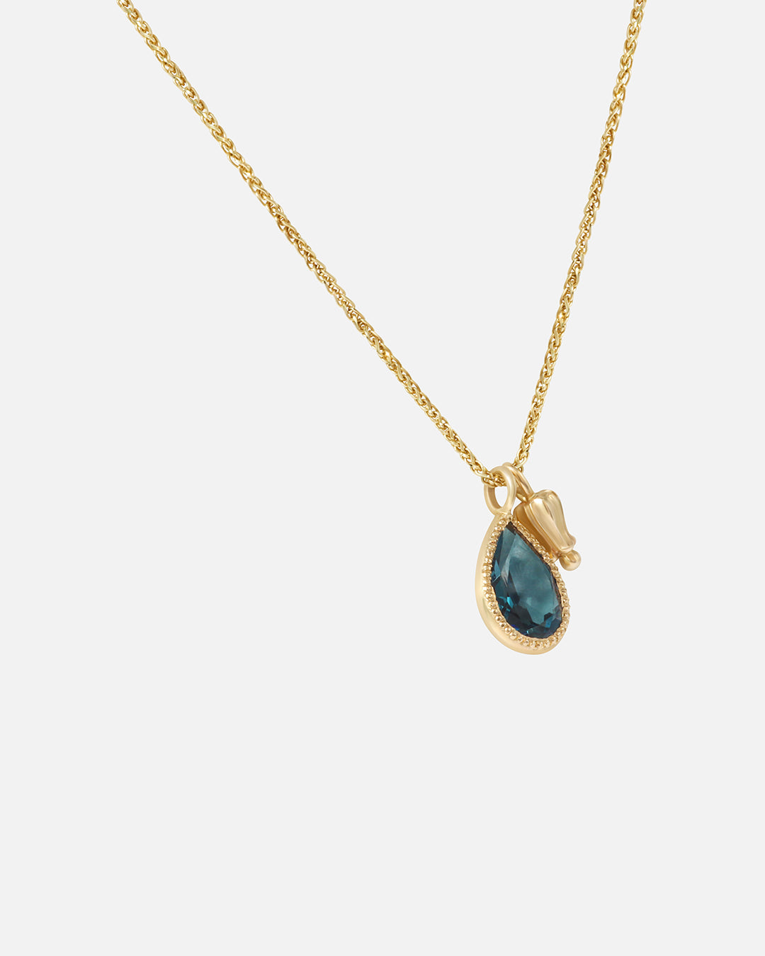 Side view of Little Mirror and Topaz Pendant