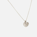 Side view of Lotus Necklace in 14k white gold