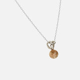 Side view of Reflections Pendant / Brown Sunstone by Young Sun Song in 14k white gold
