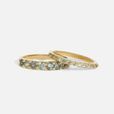 Group stacked view of Dew 3mm / Blue Green Sapphire in 18k yellow gold and Dew 1.75mm / Blue Green Sapphire in 18k yellow gold by Hiroyo