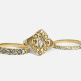 Group stacked view of Dew 3mm / Blue Green Sapphire in 18k yellow gold, Dew 41 / Colored Diamonds in 18k yellow gold, and Dew 1.75mm / Blue Green Sapphire in 18k yellow gold by Hiroyo