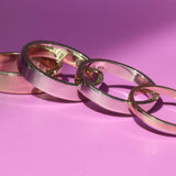 Group shot of all band width options featuring Flat Band / 5.5mm Customizable, Flat Band / 4.5mm Customizable, Flat Band / 3.5mm Customizable,  and Flat Band / 2mm Customizable