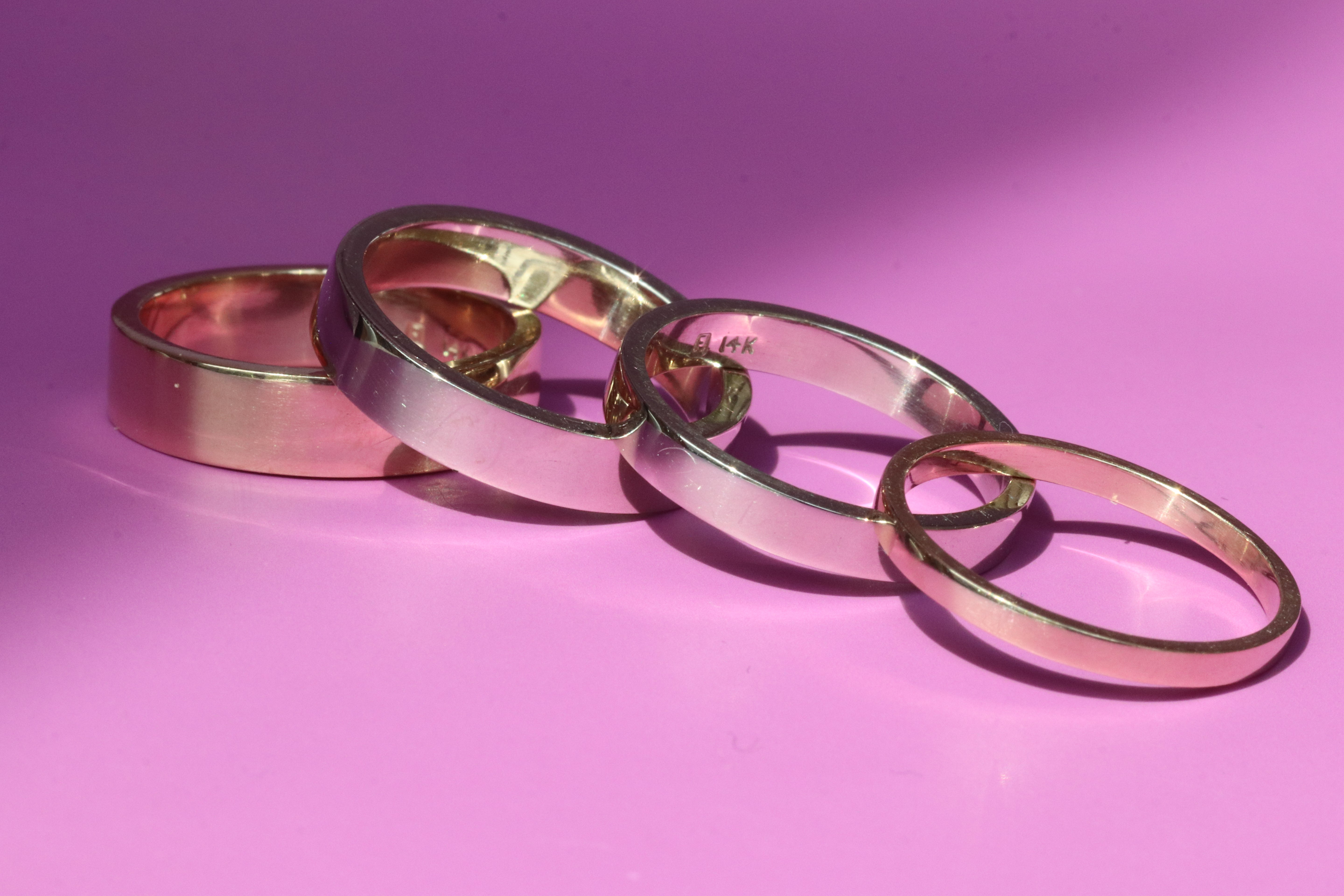 Group shot of all band width options featuring Flat Band / 5.5mm Customizable, Flat Band / 4.5mm Customizable, Flat Band / 3.5mm Customizable,  and Flat Band / 2mm Customizable