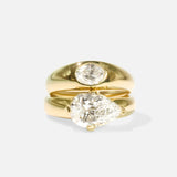 Group fully stacked view of Optic Oval Signet Ring / Diamond in 14k yellow gold and Comet Ring / Lab Pear Diamond in 14k yellow gold by Joko