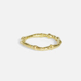 Side view of Bone Tree Band / Large in 14k yellow gold by Ides