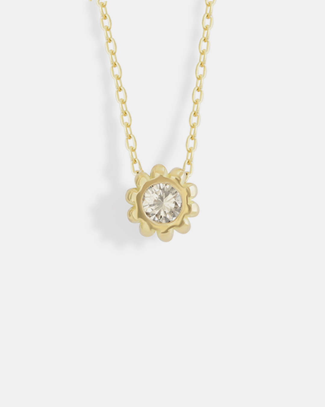 Front view of Skull Pass Thru Pendant in 18k yellow gold
