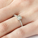 Model wears Square Bezel Skull Shank / White Diamond on ring finger