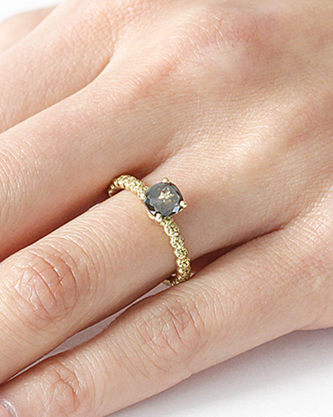 Model wears Skulls At The Rose Ball / Grey Diamond on ring finger