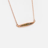Side view of Rough Grey Diamond Pendant in 14k Rose Gold
