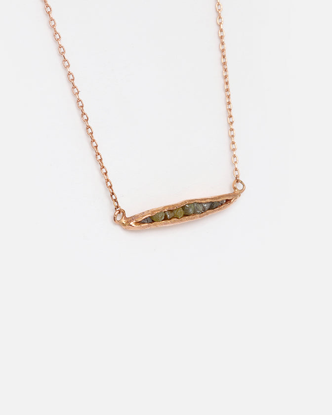 Side view of Rough Grey Diamond Pendant in 14k Rose Gold