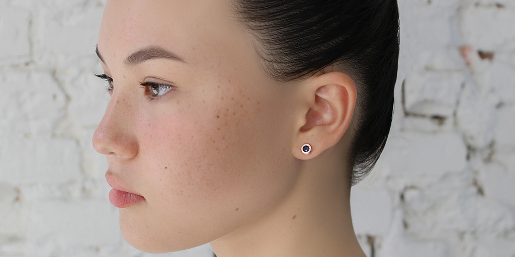 Model wears Pebble Studs / Sapphire By Hiroyo