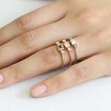 Model hand shot of all three versions of the Melee 27 rings with various gemstones
