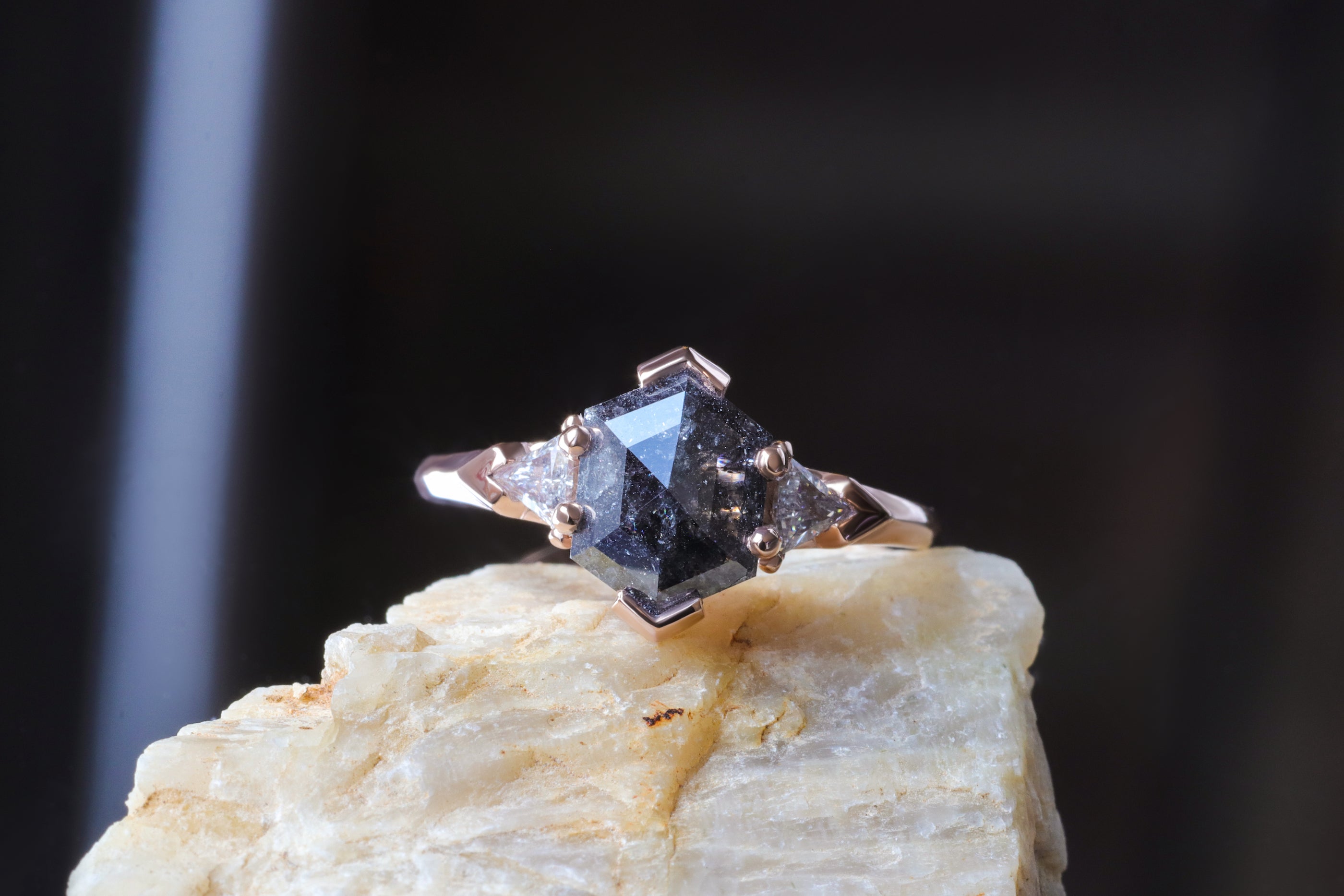 Lifestyle shot of Cygnus Ring by Fitzgerald Jewelry on a stone