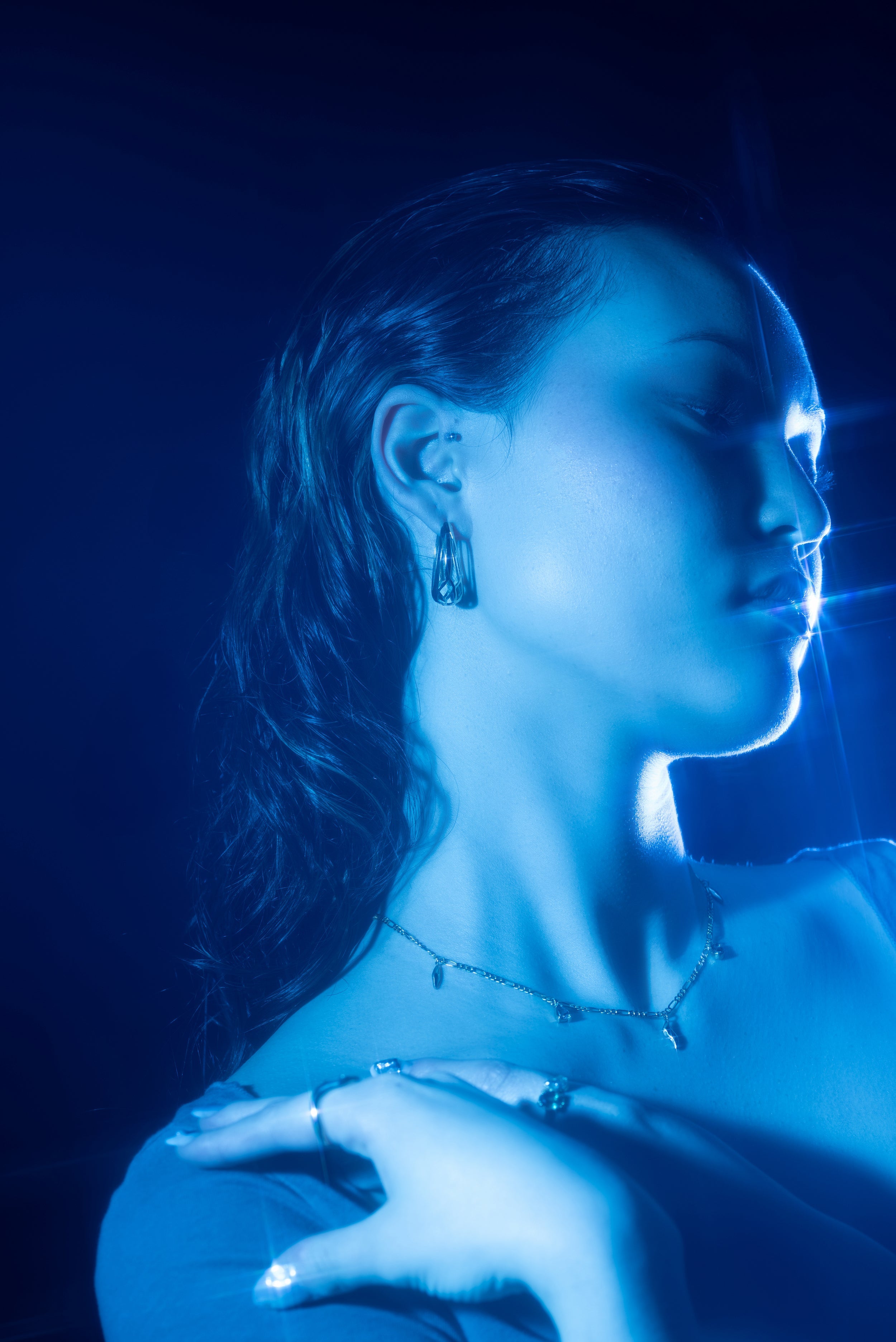 Model wears Oval Rose Cut Diamond Pendant by Fitzgerald Jewelry