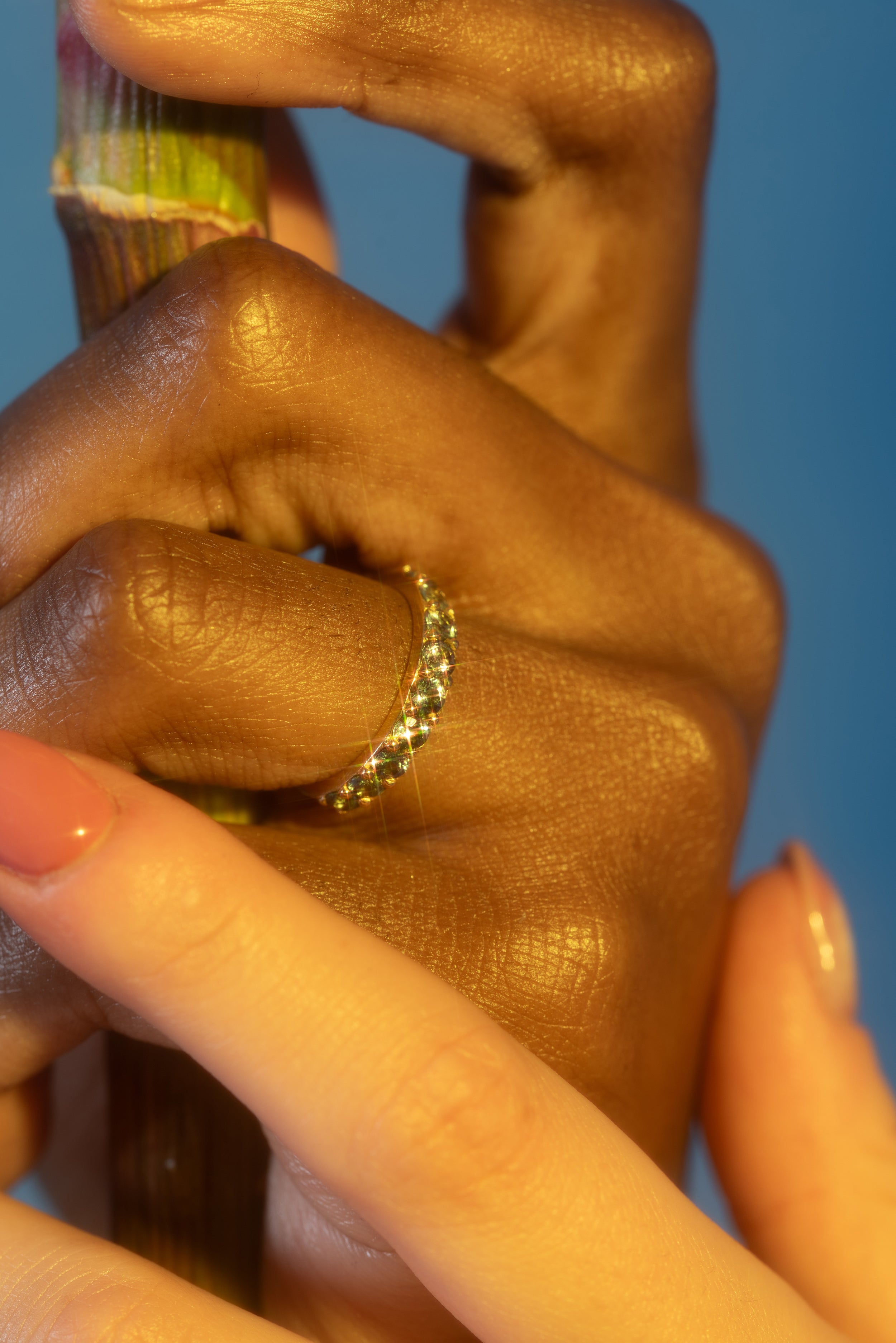 Model wears Dew 3mm / Teal Sapphire Ring on ring finger