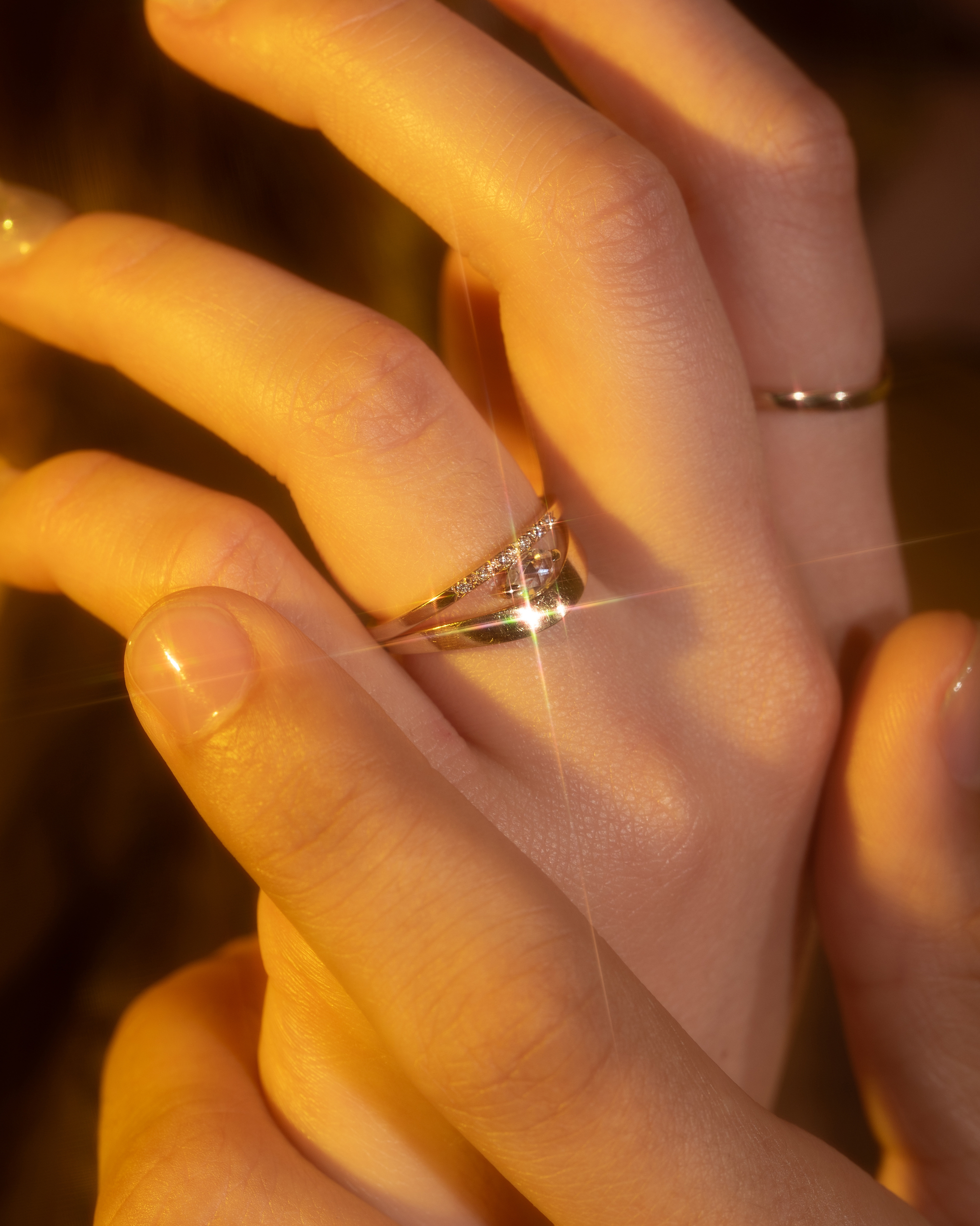 Model wears Rose Cut Pear Diamond Ring by Nishi