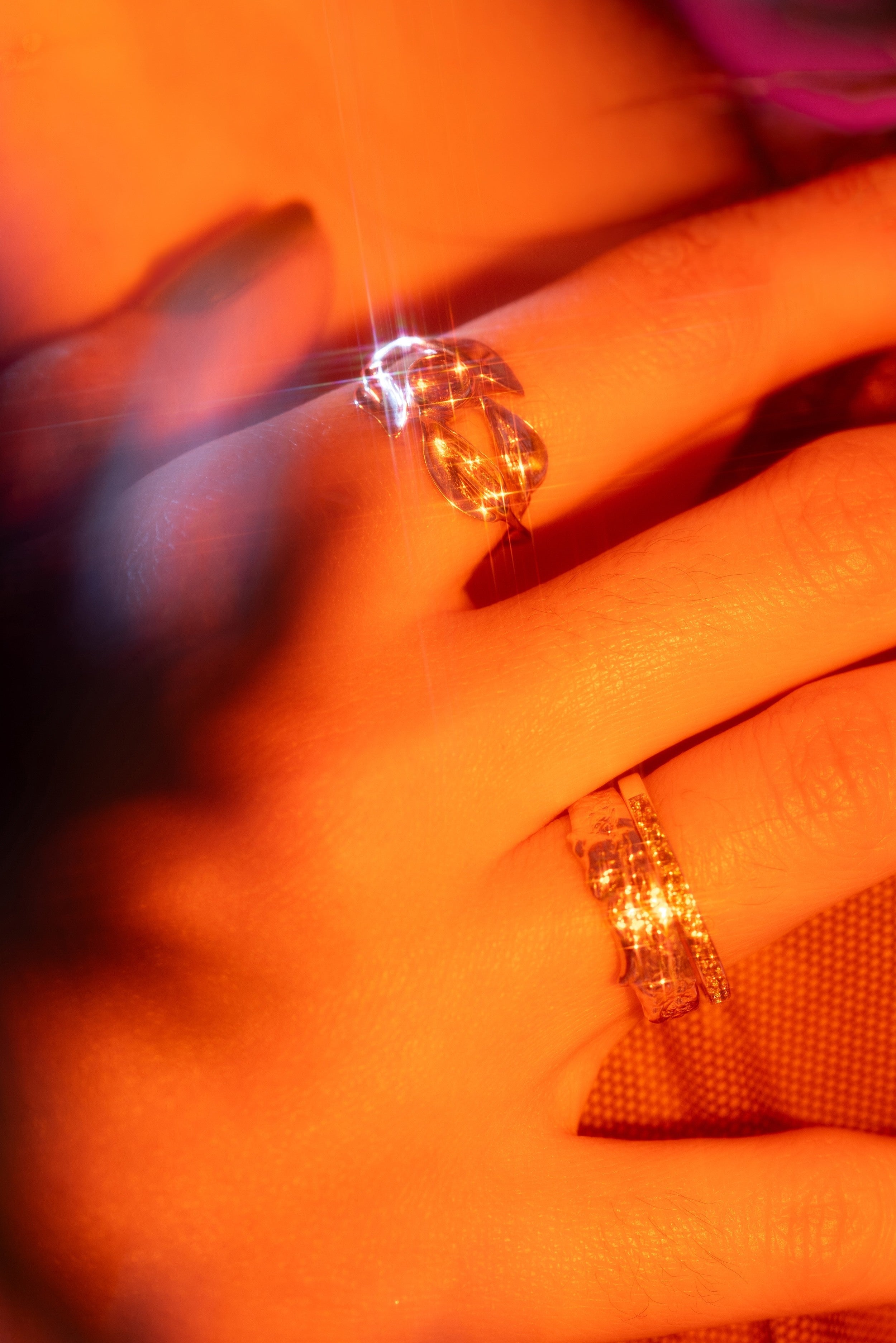 Model wears Diamond Twisted Nail Ring by Ides, Speckle Ring by tmrw days