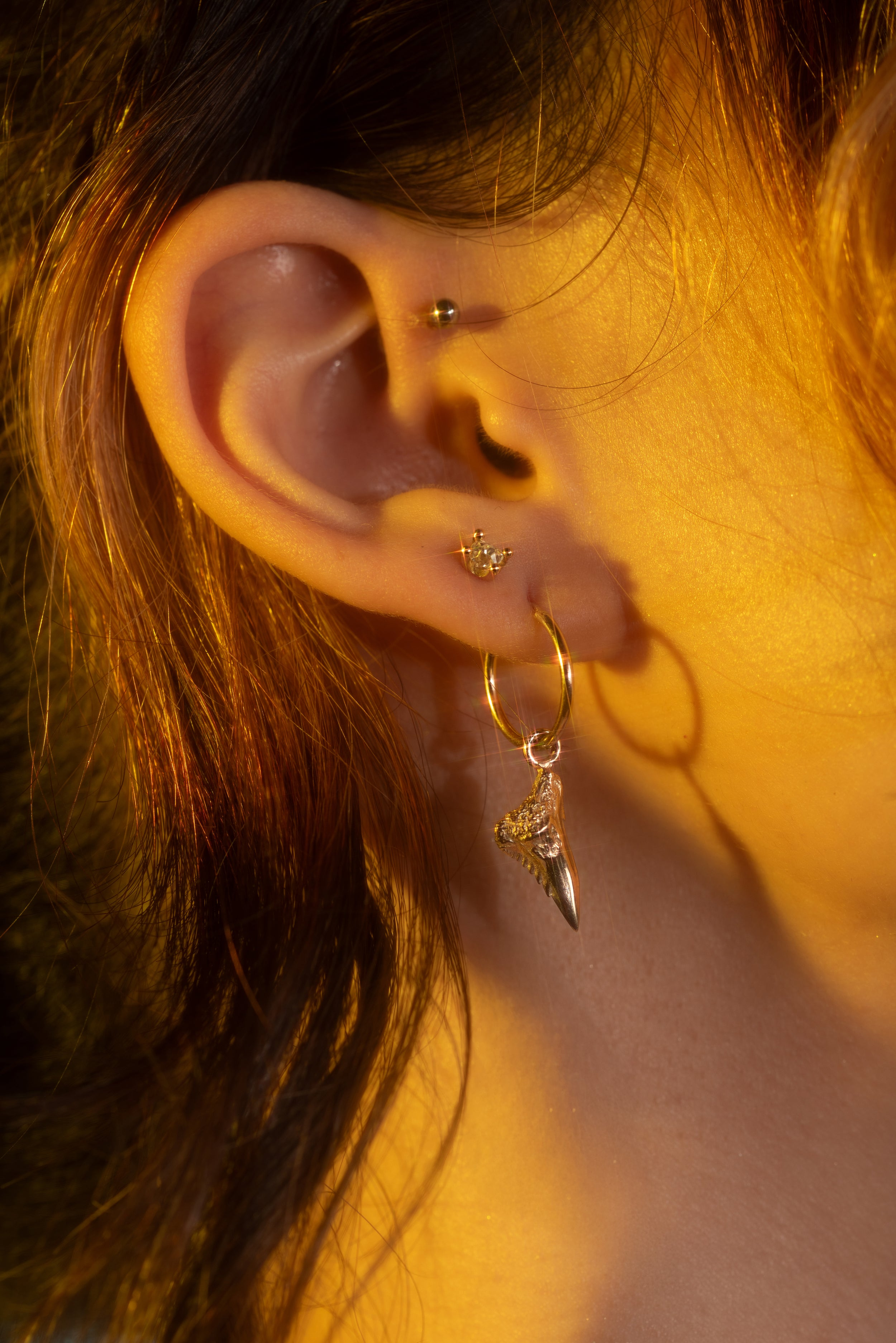 Model wears Mini Mega Crusher Charm by Ides and Dew 34 / Studs by Hiroyo