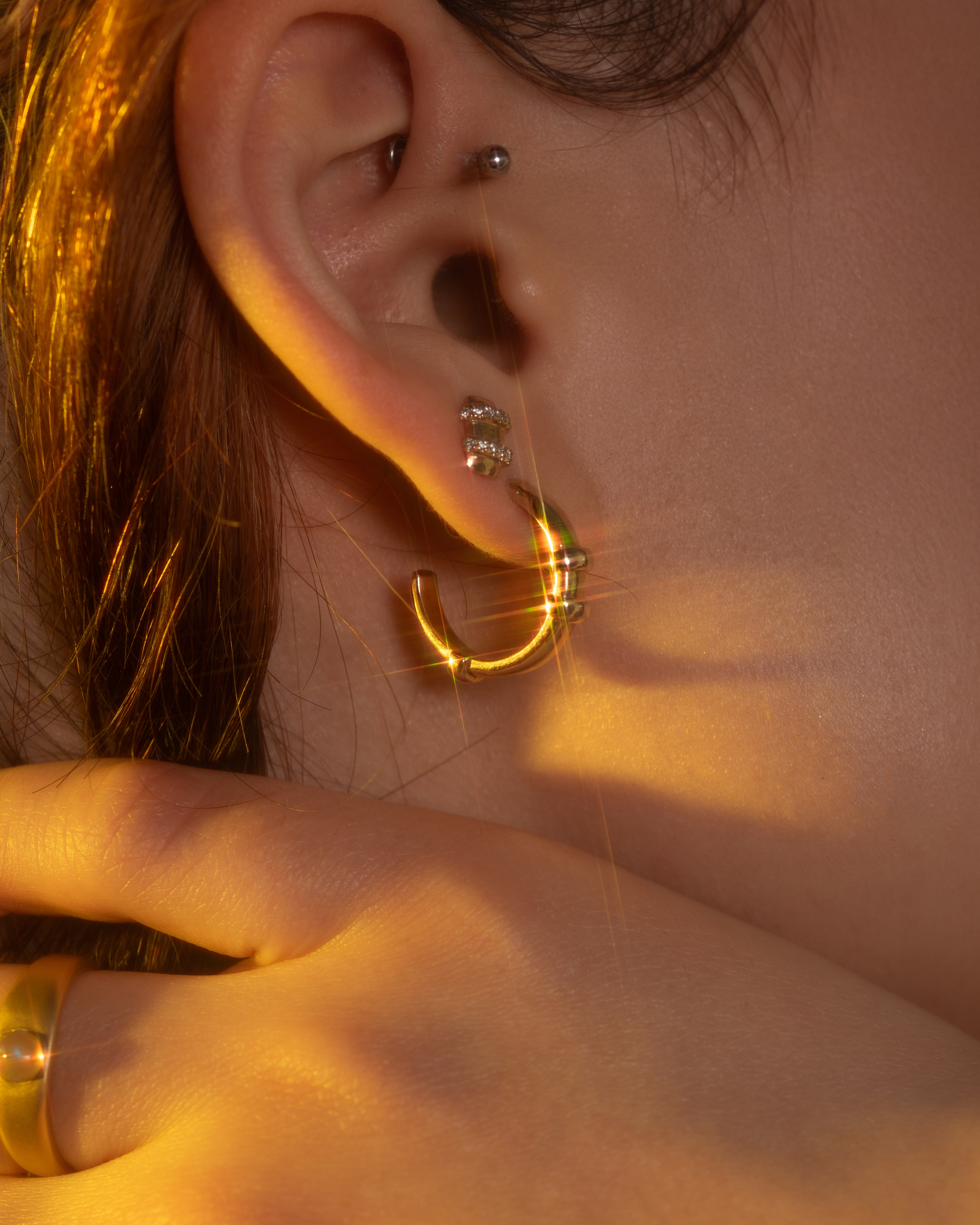 Model wears Orion Large Hoop and Orion Duo White Diamond Stud by Alfonzo 