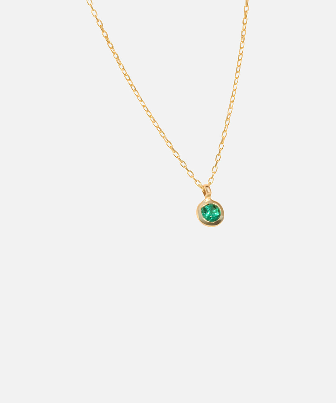 Side view of Emerald Round Pendant by Fitzgerald Jewelry