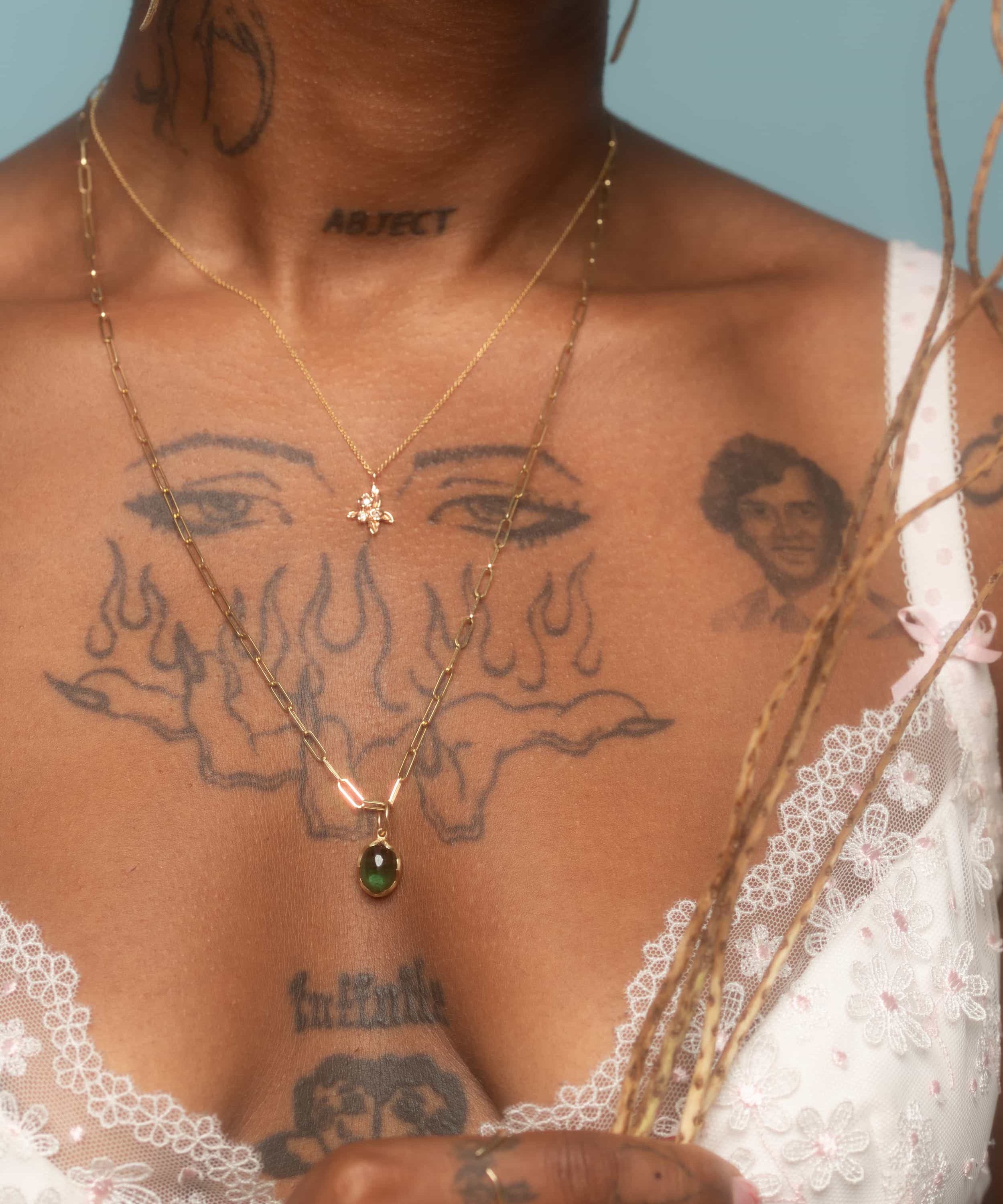 Model wears Bunch / Diamond Pendant By O Channell Designs