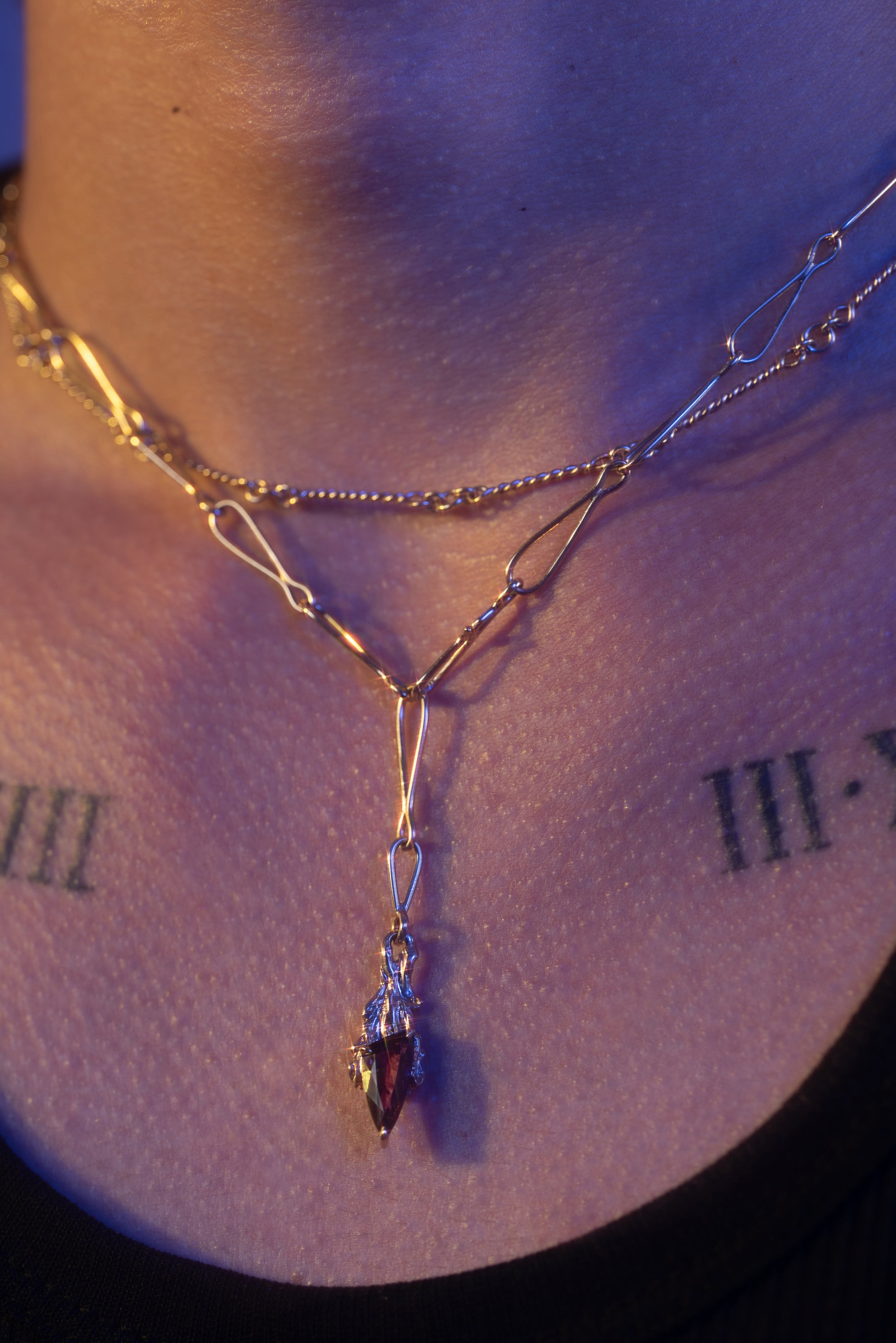 Model wears Garnet Pendant and Twisted Scrap Chain by O Channell Designs from our Jewelry collection