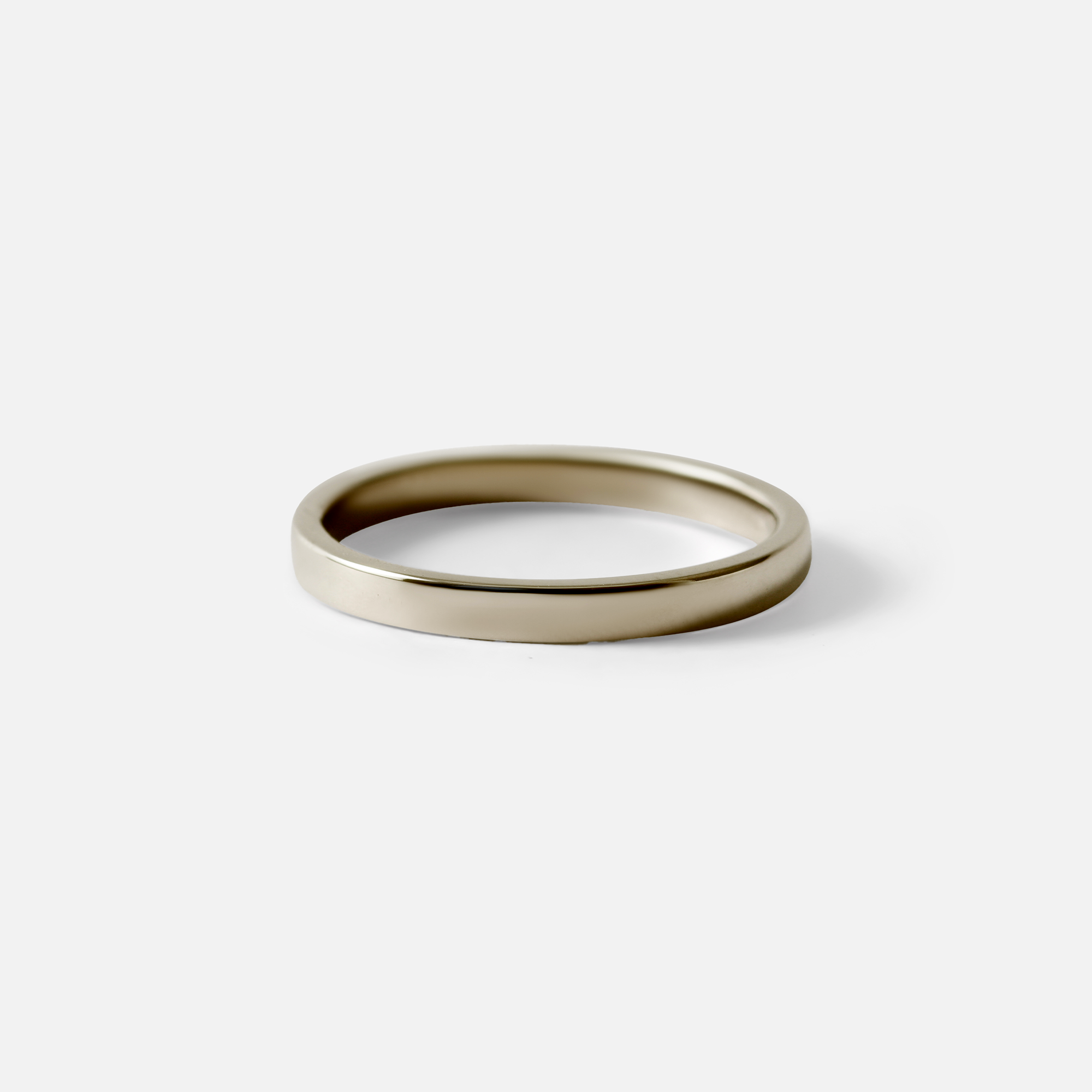 Angled view of Flat Band / 2mm Customizable By Hiroyo in 14k white gold
