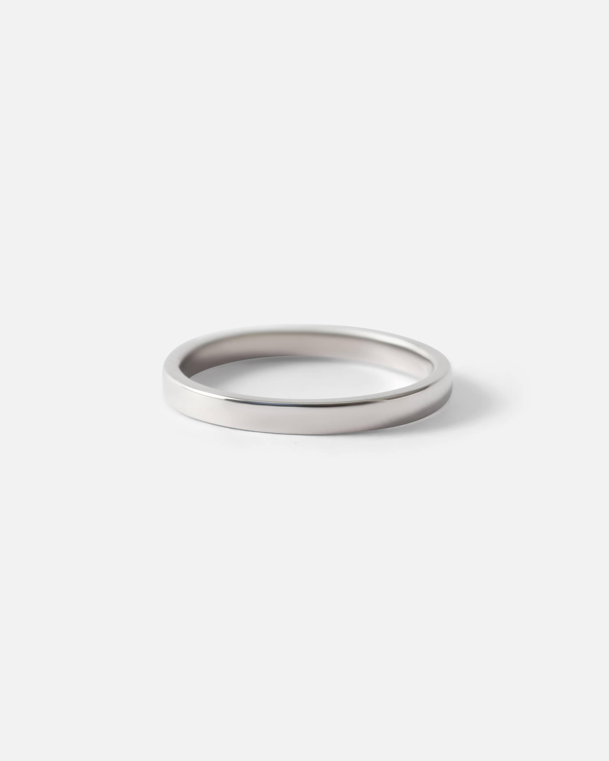 Angled view of Flat Band / 2mm Customizable By Hiroyo in Platinum