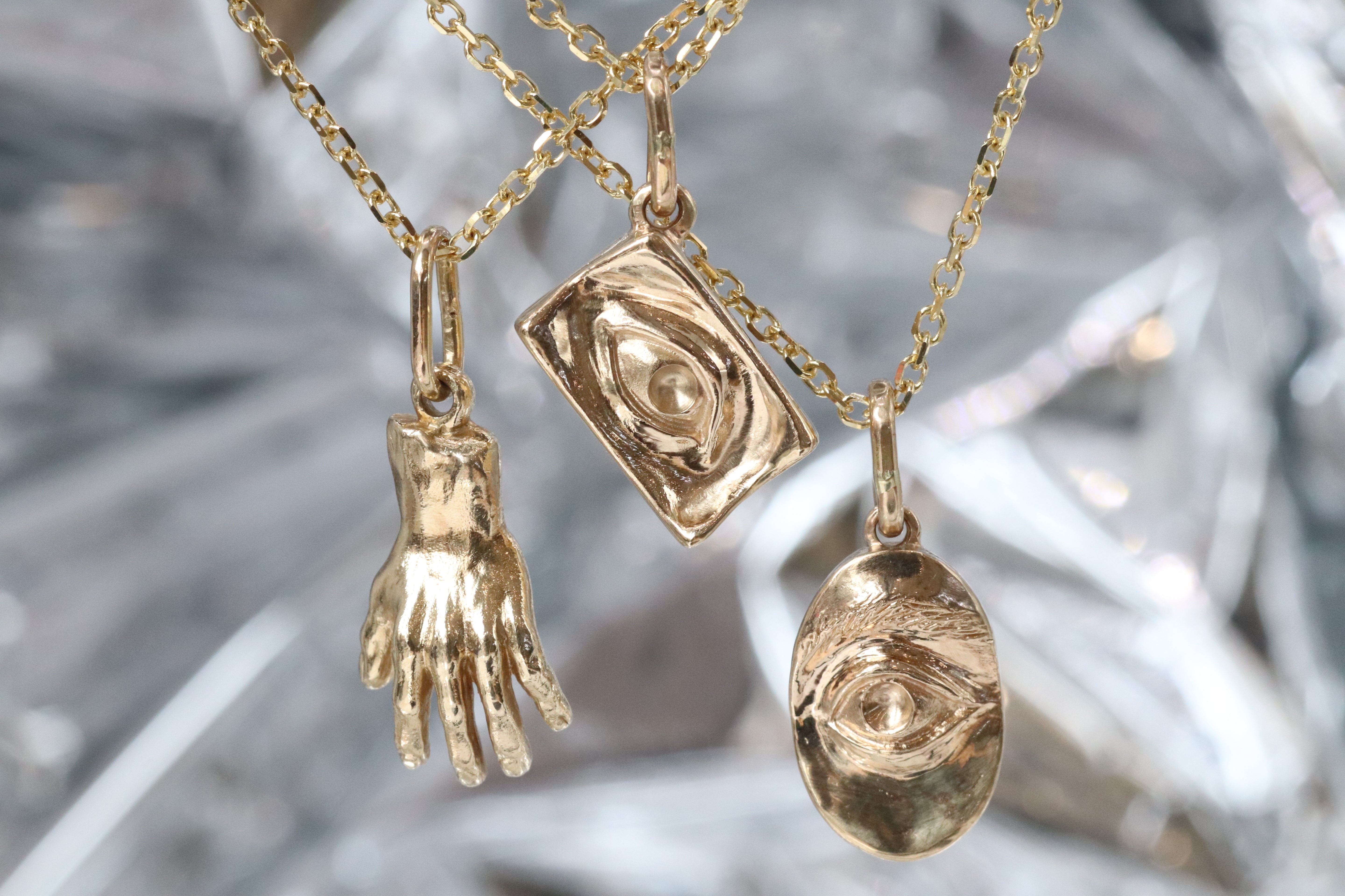 Group shout of showing back of the Theia Pendant, Intagliuax Oval Pendant, and Intagliuax Pendant