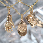 Group shout of Theia Pendant, Intagliuax Oval Pendant, and Intagliuax Pendant