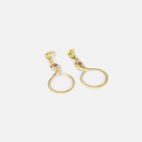 Angled flat lay view of Ophidia Drop Circuli Earrings by Ides