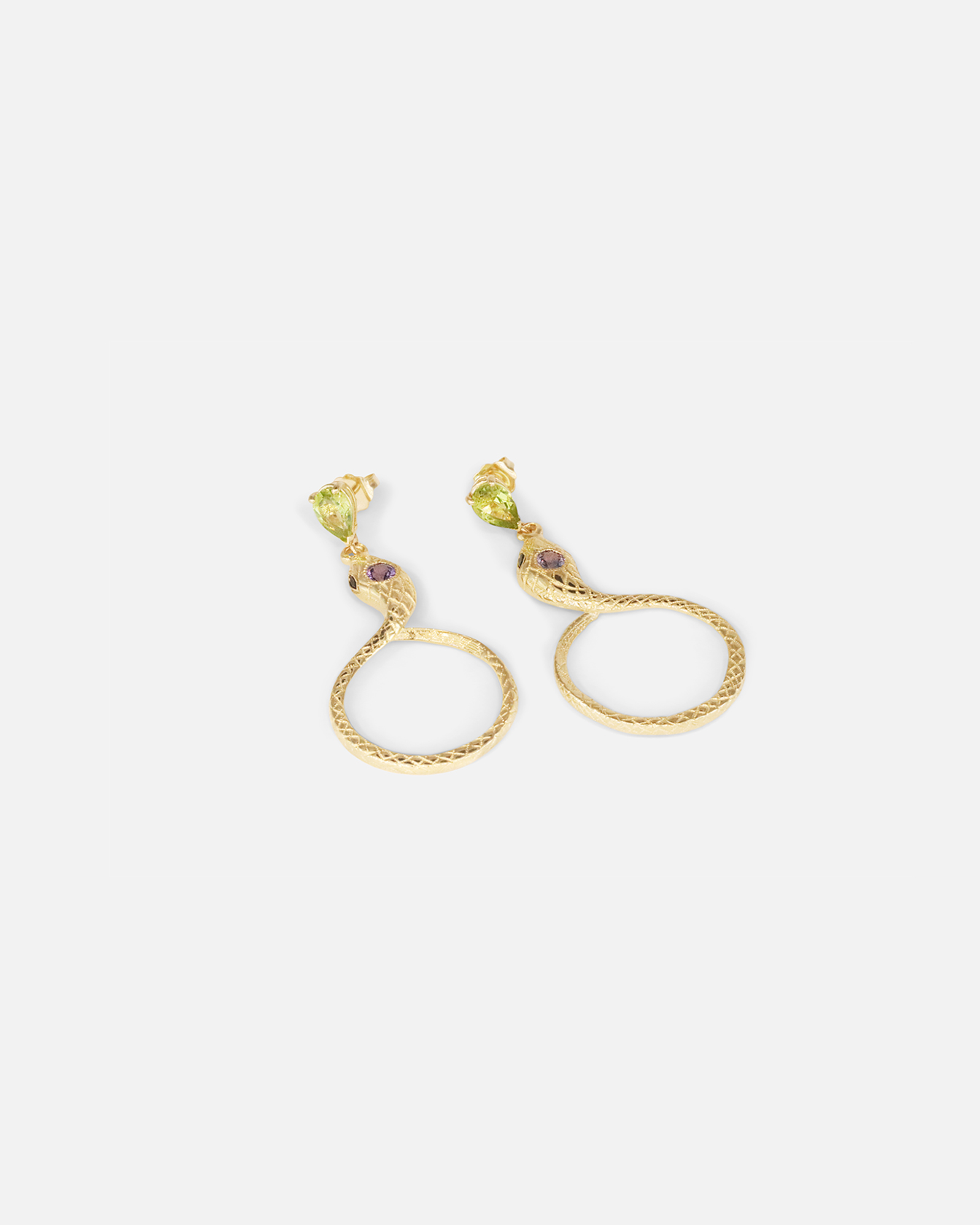 Angled flat lay view of Ophidia Drop Circuli Earrings by Ides