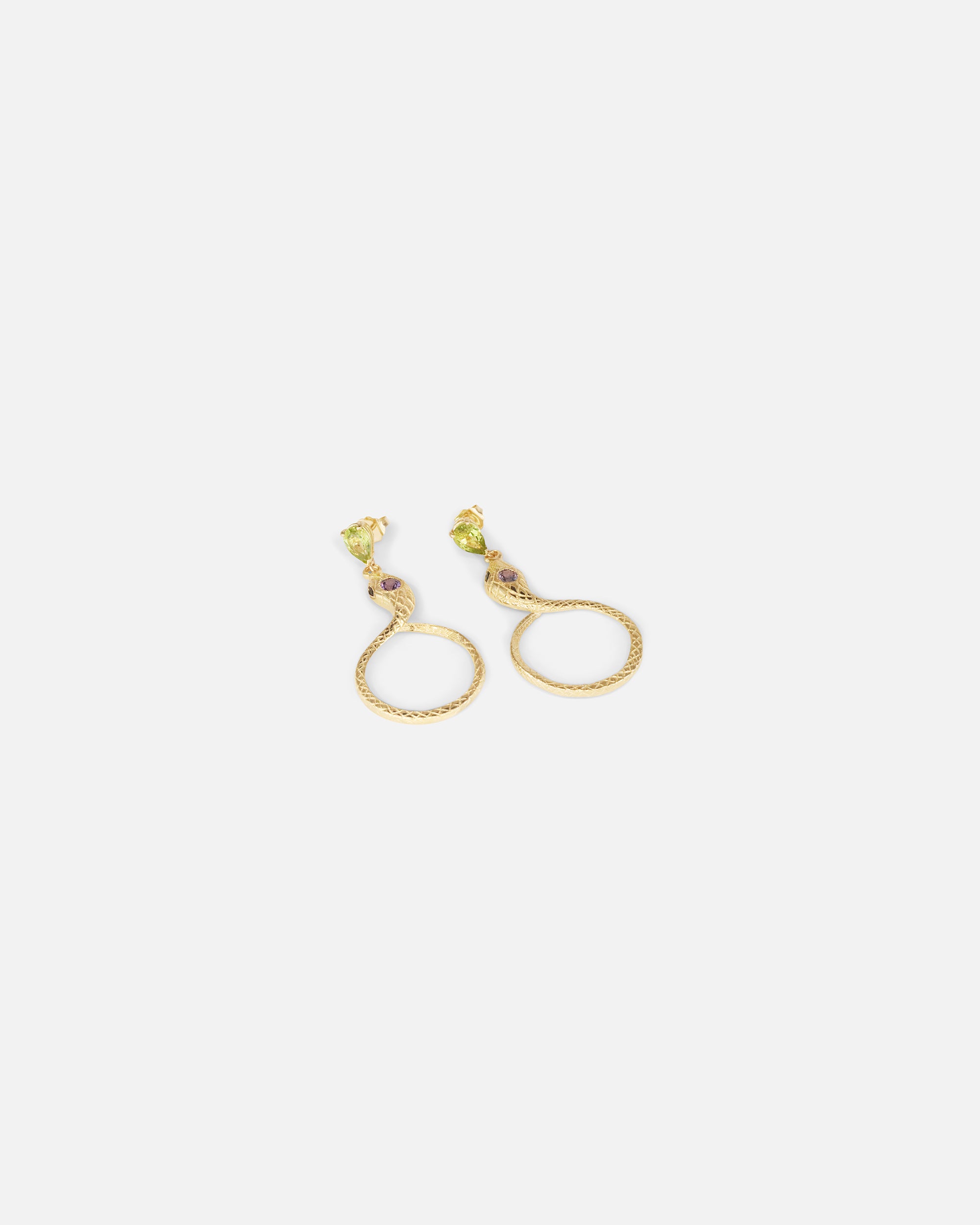Angled flat lay view of Ophidia Drop Circuli Earrings by Ides