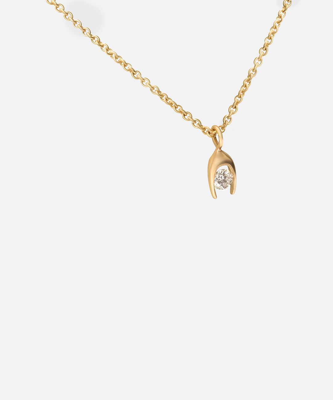 Side view of Y Round Pendant by Lucia B Marti 
