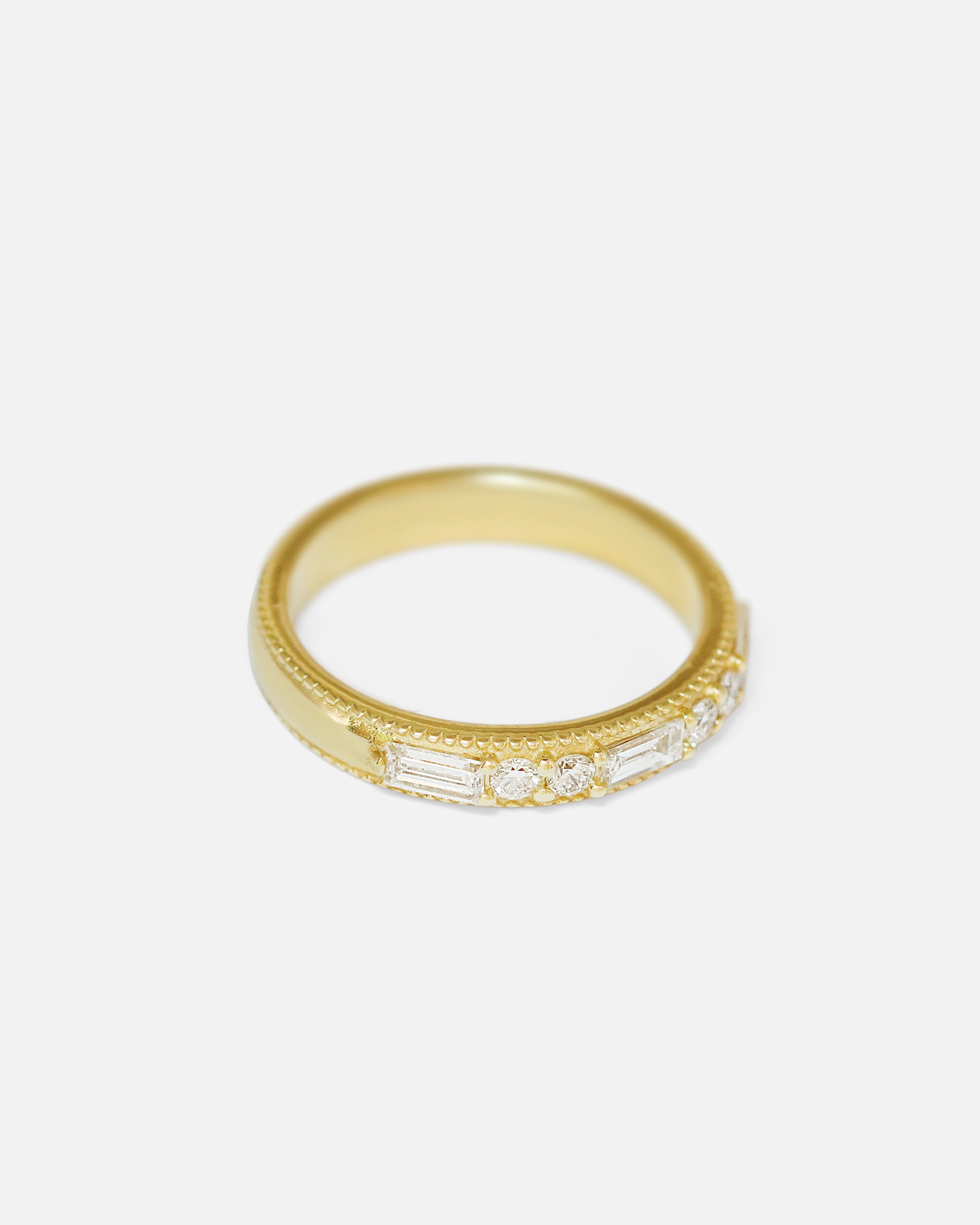 Angled side view of Milgrain Diamond & Baguette Band by tmrw days